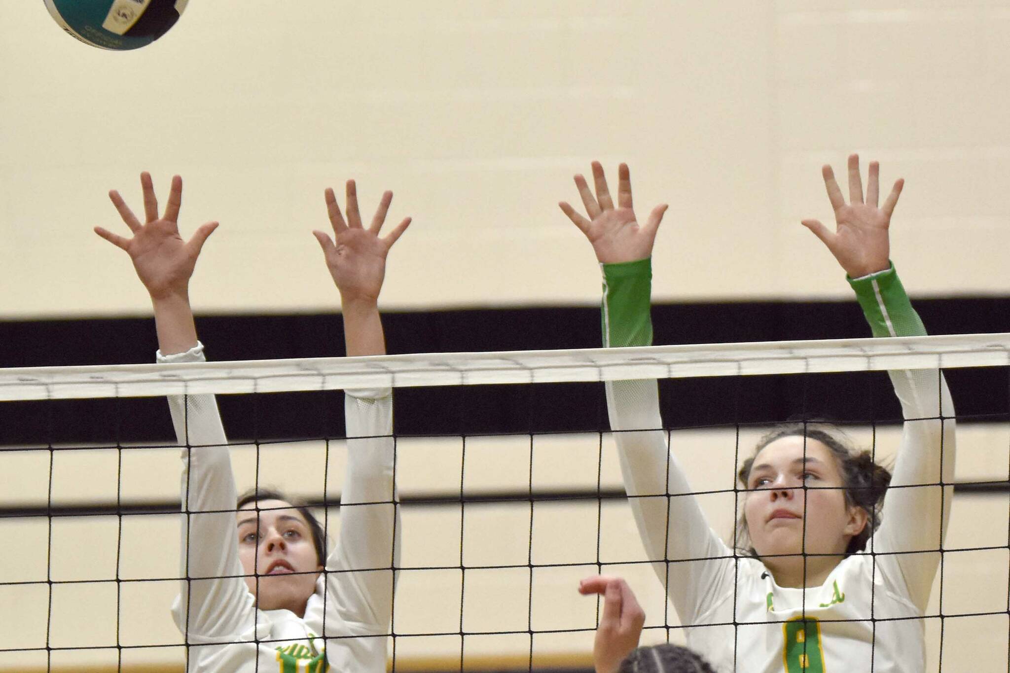 Seward's Teyla Ramsey and Mikinley Williams try to block Nikiski's Savanna Stock on Thursday, Oct. 13, 2022, at Nikiski High School in Nikiski, Alaska. (Photo by Jeff Helminiak/Peninsula Clarion)