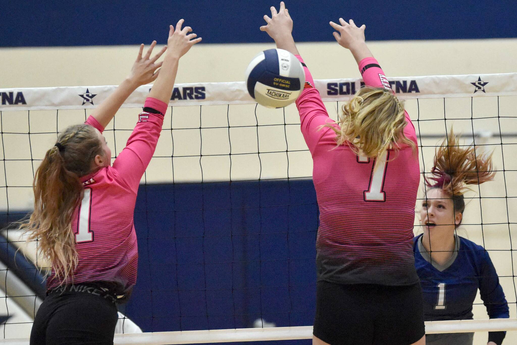 Soldotna's Katelyn Morrison attacks on Kenai Central's Grace Beiser and Emma Beck on Tuesday, Oct. 25, 2022, at Soldotna High School in Soldotna, Alaska. (Photo by Jeff Helminiak/Peninsula Clarion)