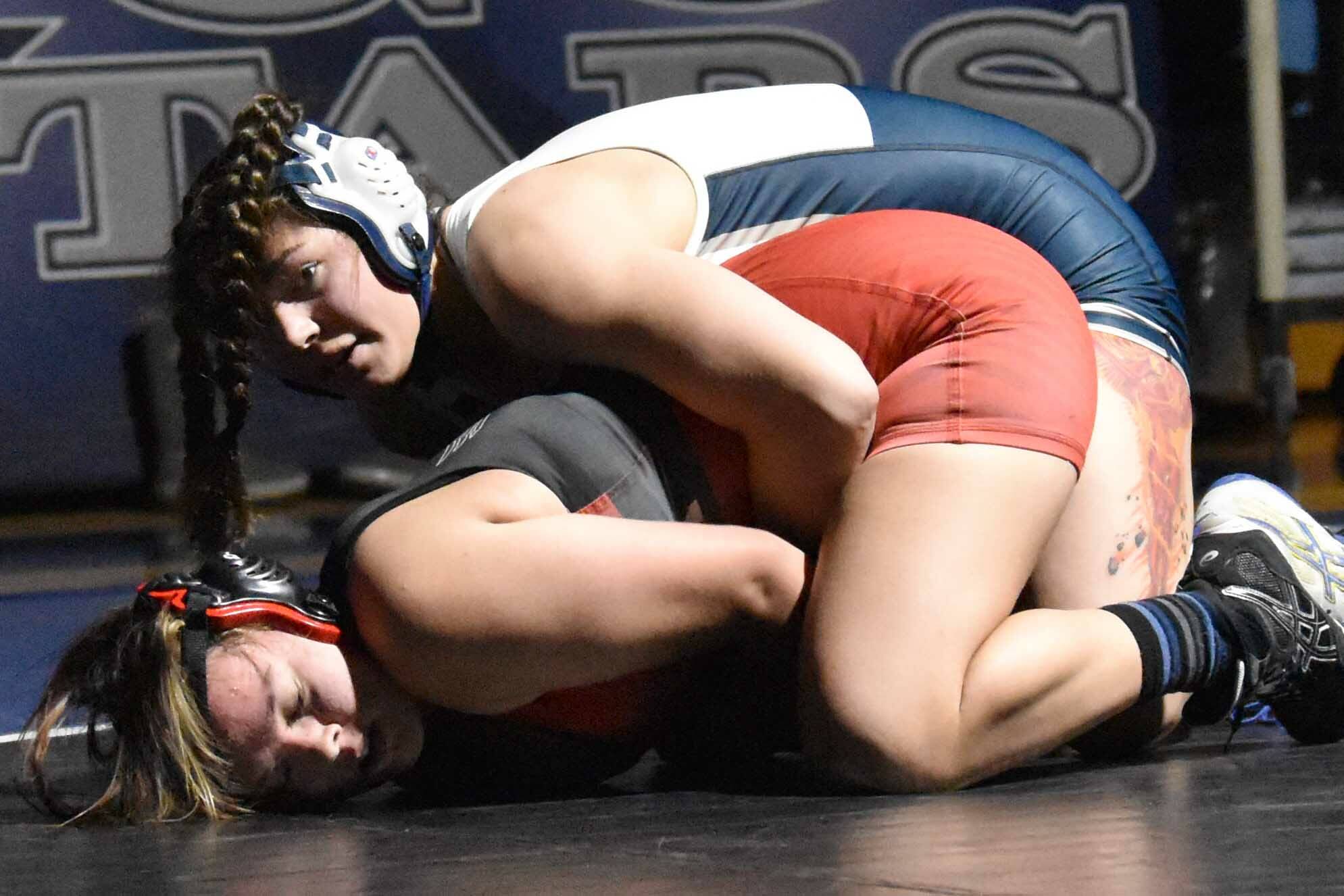 Soldotna's Trinity Donovan works to a pin of Kenai Central's Jenna Yeoman at 152 pounds Tuesday, Nov. 1, 2022, at Soldotna High School in Soldotna, Alaska. (Photo by Jeff Helminiak/Peninsula Clarion)