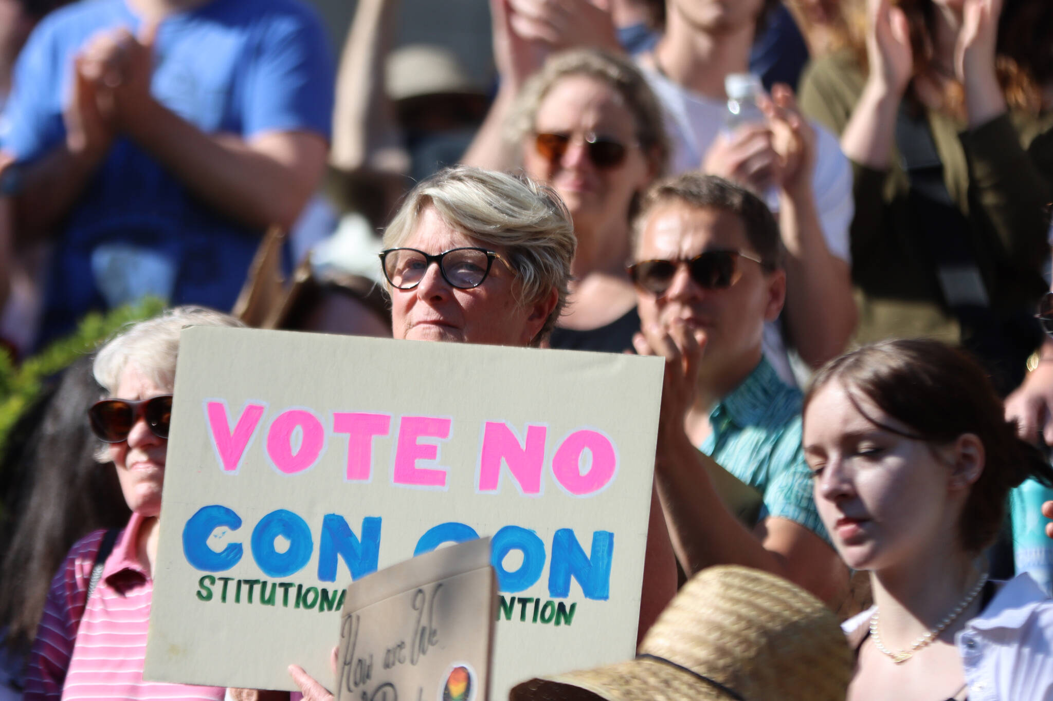 Former Democratic state Rep. Beth Kerttula holds up a sign reading “Vote No Con Con,” during a recent rally at the Dimond Courthouse Plaza in Juneau. Ben Hohenstatt / Juneau Empire File)