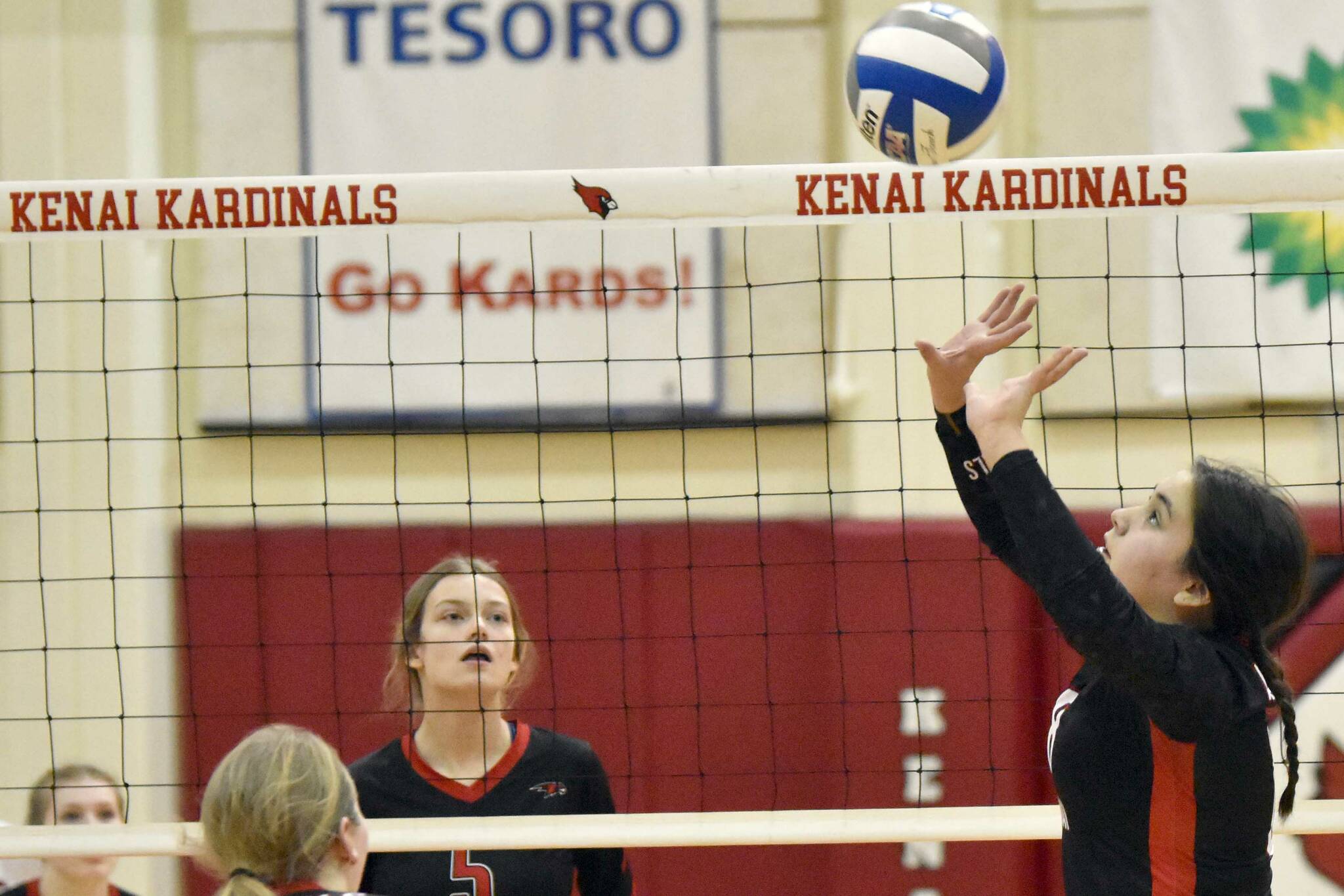 Kenai Central's Jorgi Phillips sets against Houston on Friday, Nov. 4, 2022, at the Southcentral Conference volleyball tournament at Kenai Central High School in Kenai, Alaska. (Photo by Jeff Helminiak/Peninsula Clarion)