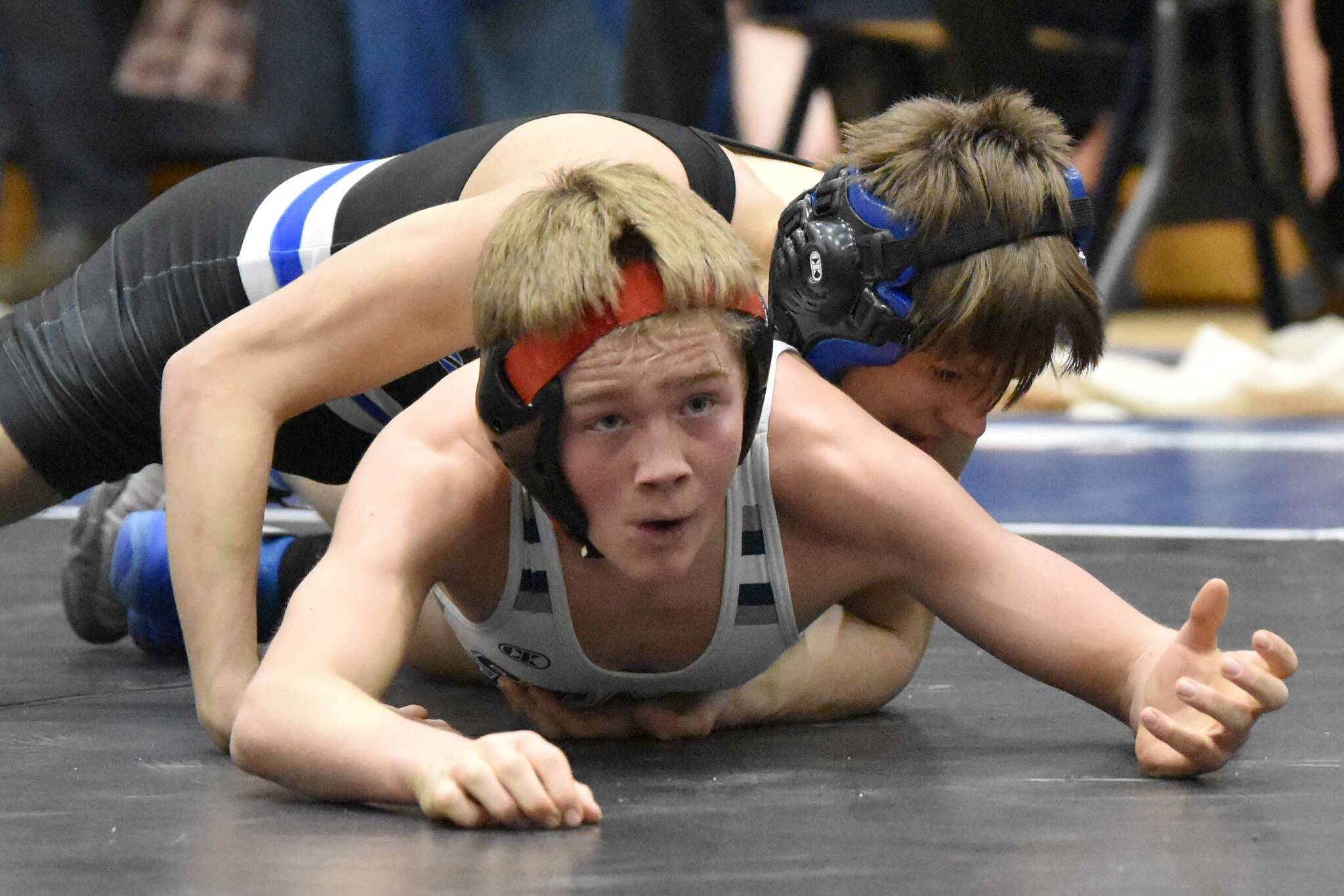 Soldotna's Jacob Strausbaugh wrestles to a Northern Lights Conference title over Palmer's Kael Salisbury at 112 pounds Saturday, Dec. 10, 2022, at Soldotna High School in Soldotna, Alaska. (Photo by Jeff Helminiak/Peninsula Clarion)