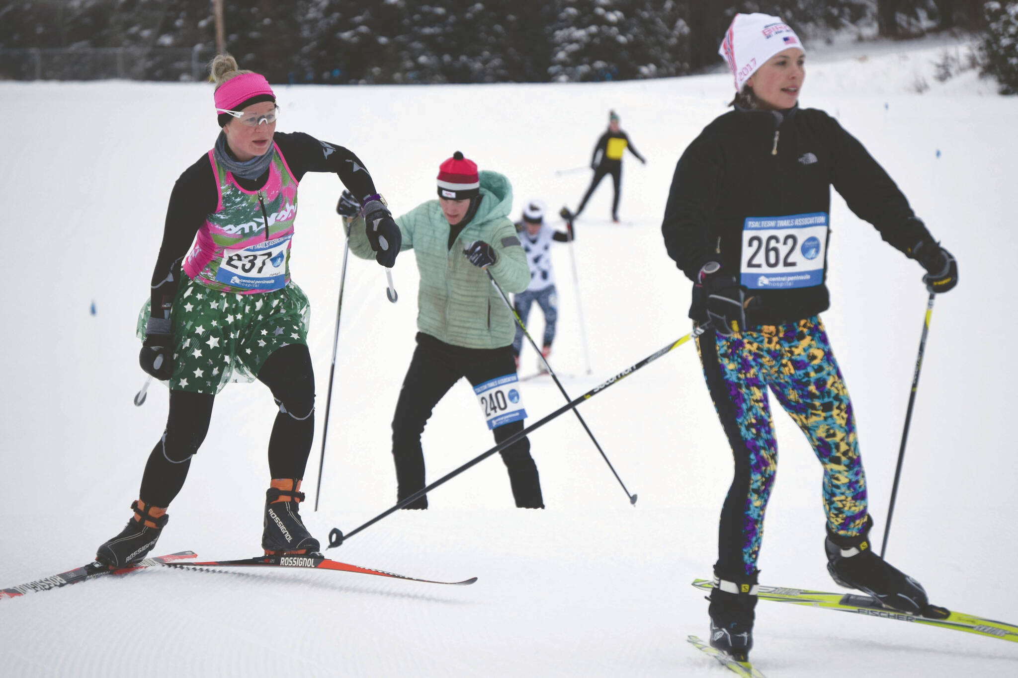 Eventual race winner Morgan Aldridge chases Libby Jensen, who finished third, and is chased by Amy Anderson, who took second, at the Ski for Women on Sunday, Feb. 2, 2020, at Tsalteshi Trails just outside of Soldotna. (Photo by Jeff Helminiak/Peninsula Clarion)