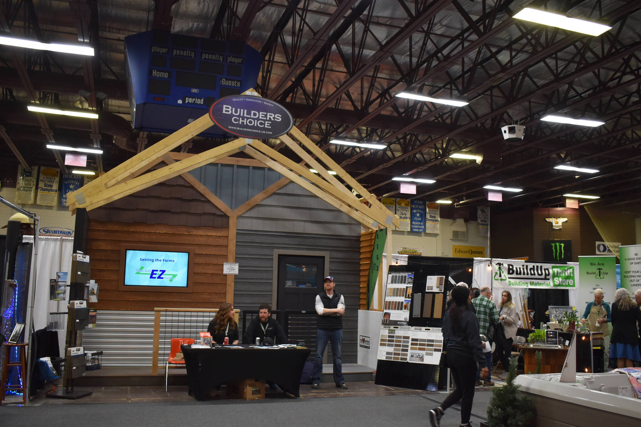 A large wooden structure makes up the booth for Builders Choice at the 43rd Annual Home Show hosted by the Kenai Peninsula Builders Association on Sunday, April 23, 2023, at the Soldotna Regional Sports Complex in Soldotna, Alaska. (Jake Dye/Peninsula Clarion)
