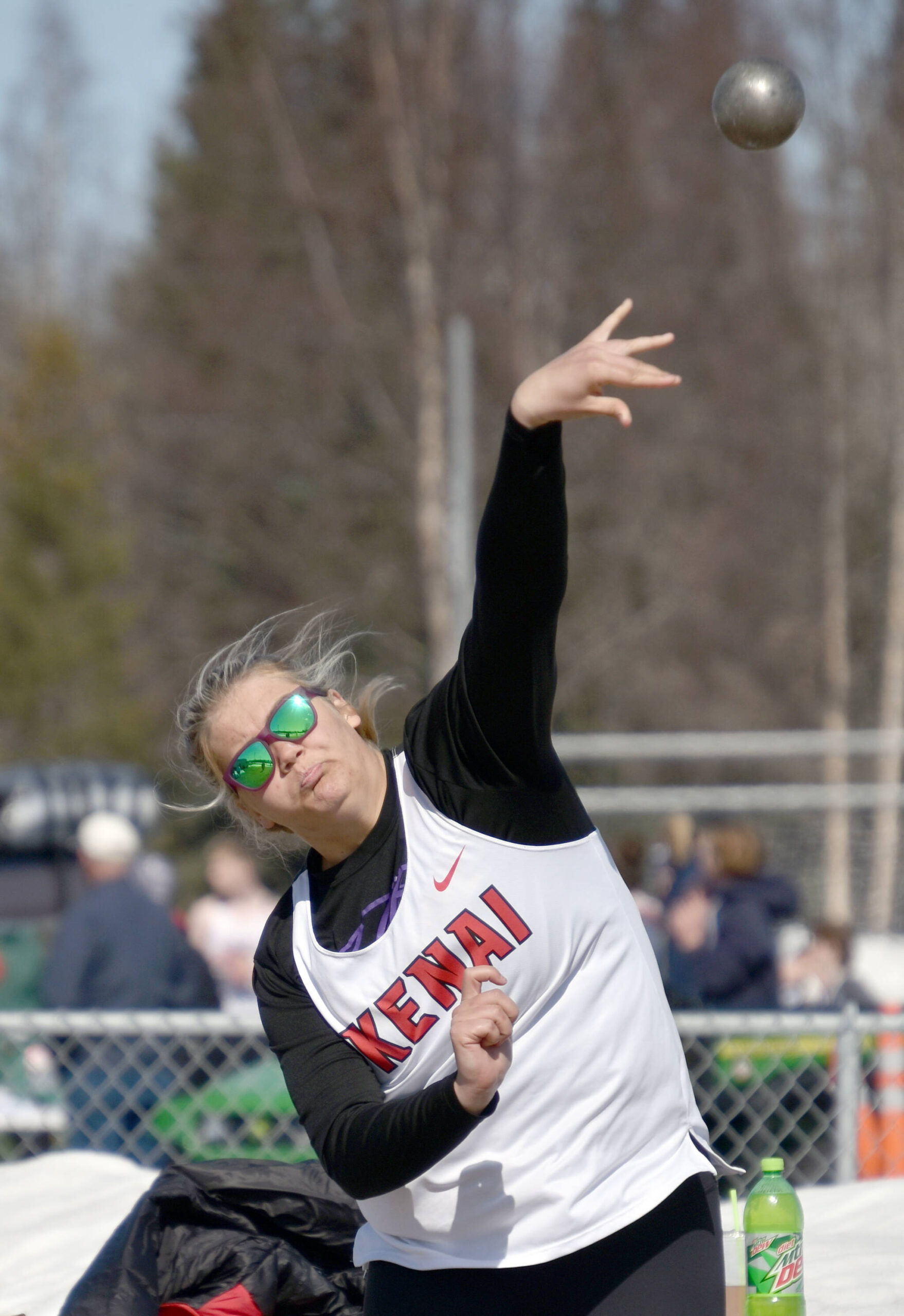 Kenai Central’s Emma Beck tosses the shot put Saturday, April 29, 2023, at Ed Hollier Field at Kenai Central High School in Kenai, Alaska. (Photo by Jeff Helminiak/Peninsula Clarion)