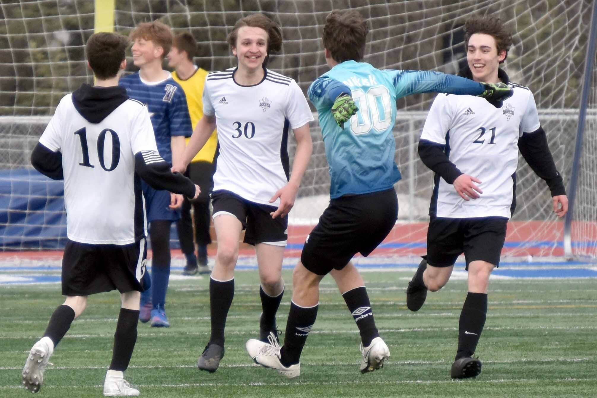The Nikiski boys soccer team celebrates the goal of Niles Broussard (30) on Wednesday, May 3, 2023, at Justin Maile Field at Soldotna High School in Soldotna, Alaska. (Photo by Jeff Helminiak/Peninsula Clarion)