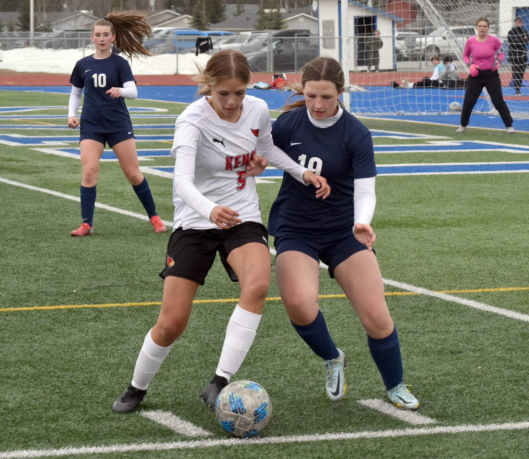 Kenai Central’s Chloe Goldsby and Soldotna’s Anika Jedlicka battle for the ball Monday, May 8, 2023, at Justin Maile Field at Soldotna High School in Soldotna, Alaska. (Photo by Jeff Helminiak/Peninsula Clarion)