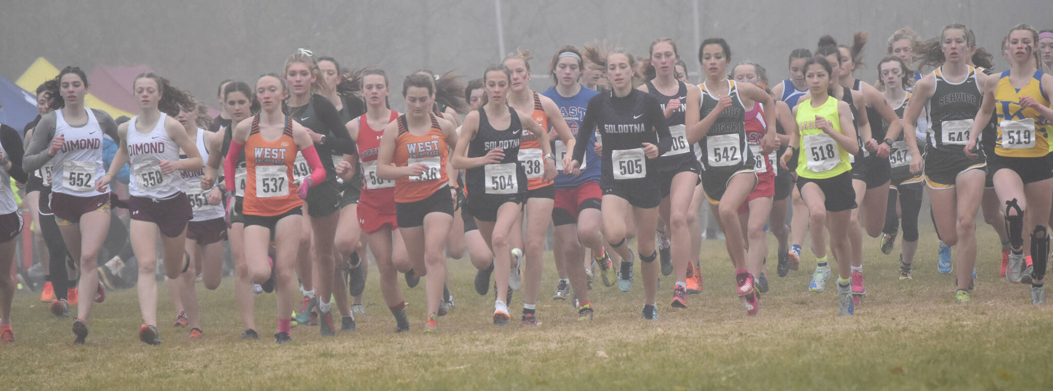 Soldotna’s Tania Boonstra and Kathryn DeBardelaben lead the pack from the start Saturday, Oct. 7, 2023, in the Division I girls state cross-country race at Palmer High School in Palmer, Alaska. (Photo by Jeff Helminiak/Peninsula Clarion)