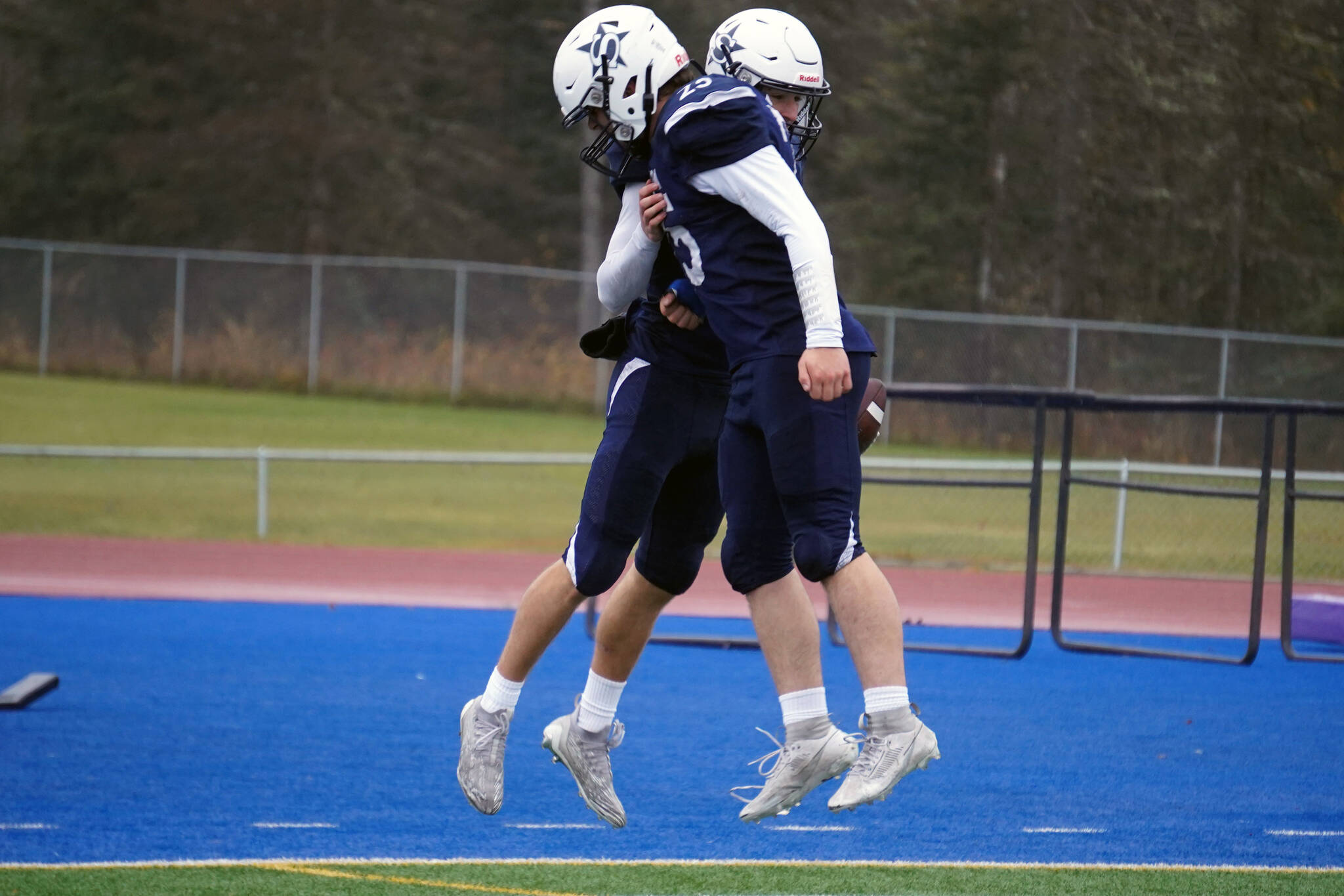 Soldotna’s Zac Buckbee and Gehret Medcoff celebrate a touchdown during the Division II semifinal against North Pole at Justin Maile Field in Soldotna, Alaska, on Saturday, Oct. 14, 2023. (Jake Dye/Peninsula Clarion)