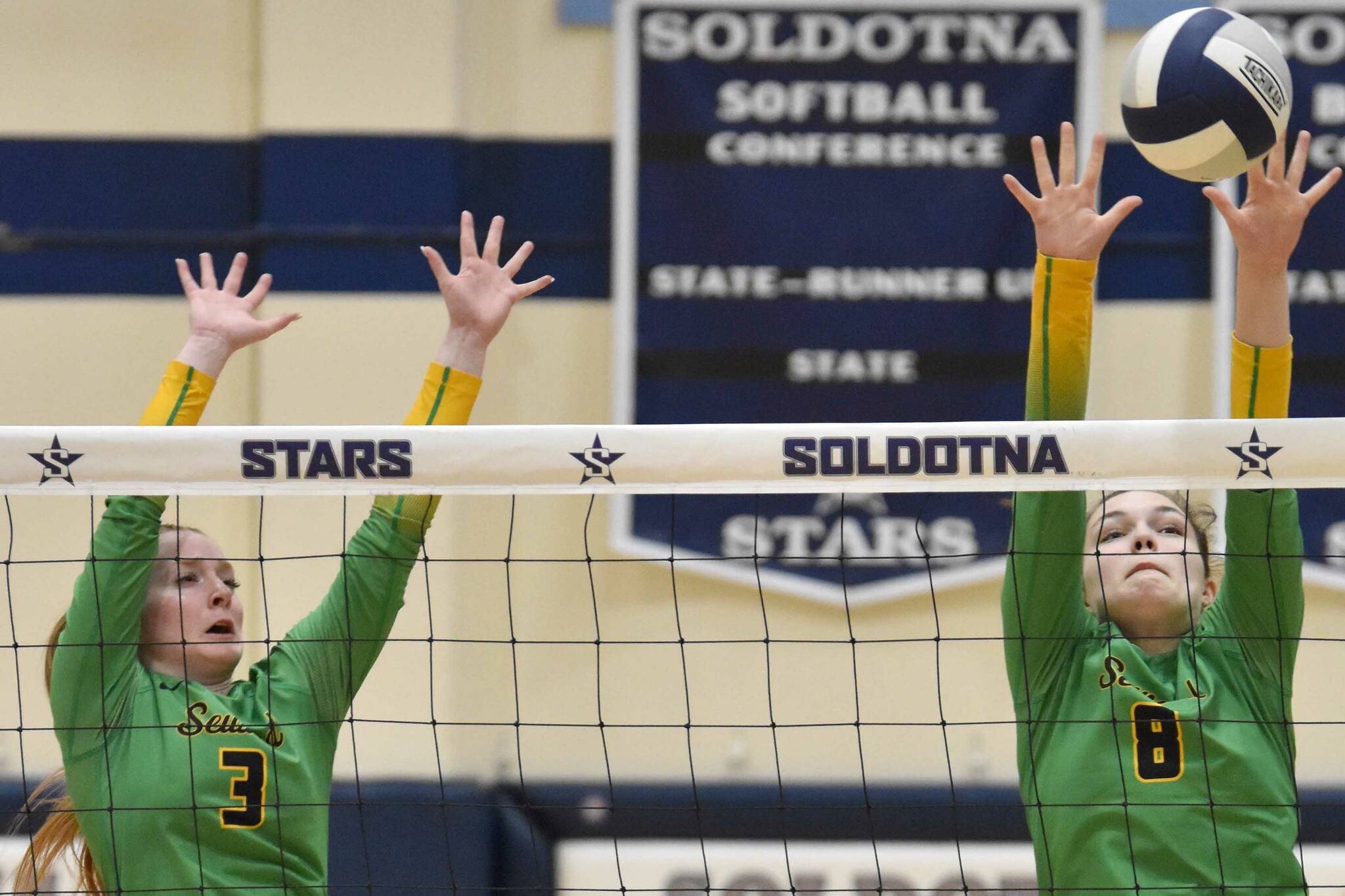 Seward's Robin Cronin and McKinley Williams put up a block against Soldotna on Tuesday, Oct. 17, 2023, at Soldotna High School in Soldotna, Alaska. (Photo by Jeff Helminiak/Peninsula Clarion)