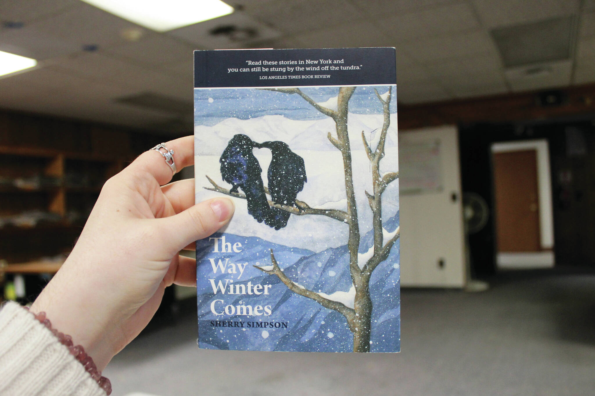 Ashlyn O’Hara/Peninsula Clarion
A copy of Sherry Simpson’s “The Way Winter Comes” is held in the Peninsula Clarion offices on Tuesday in Kenai.