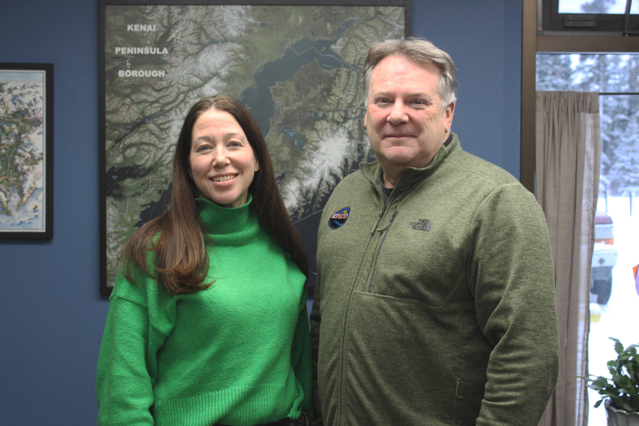 Cassidi Cameron, left, and Tim Dillon stand in Dillon’s office at the Kenai Peninsula Economic Development District on Tuesday, Dec. 12, 2023 near Kenai, Alaska. (Ashlyn O’Hara/Peninsula Clarion)