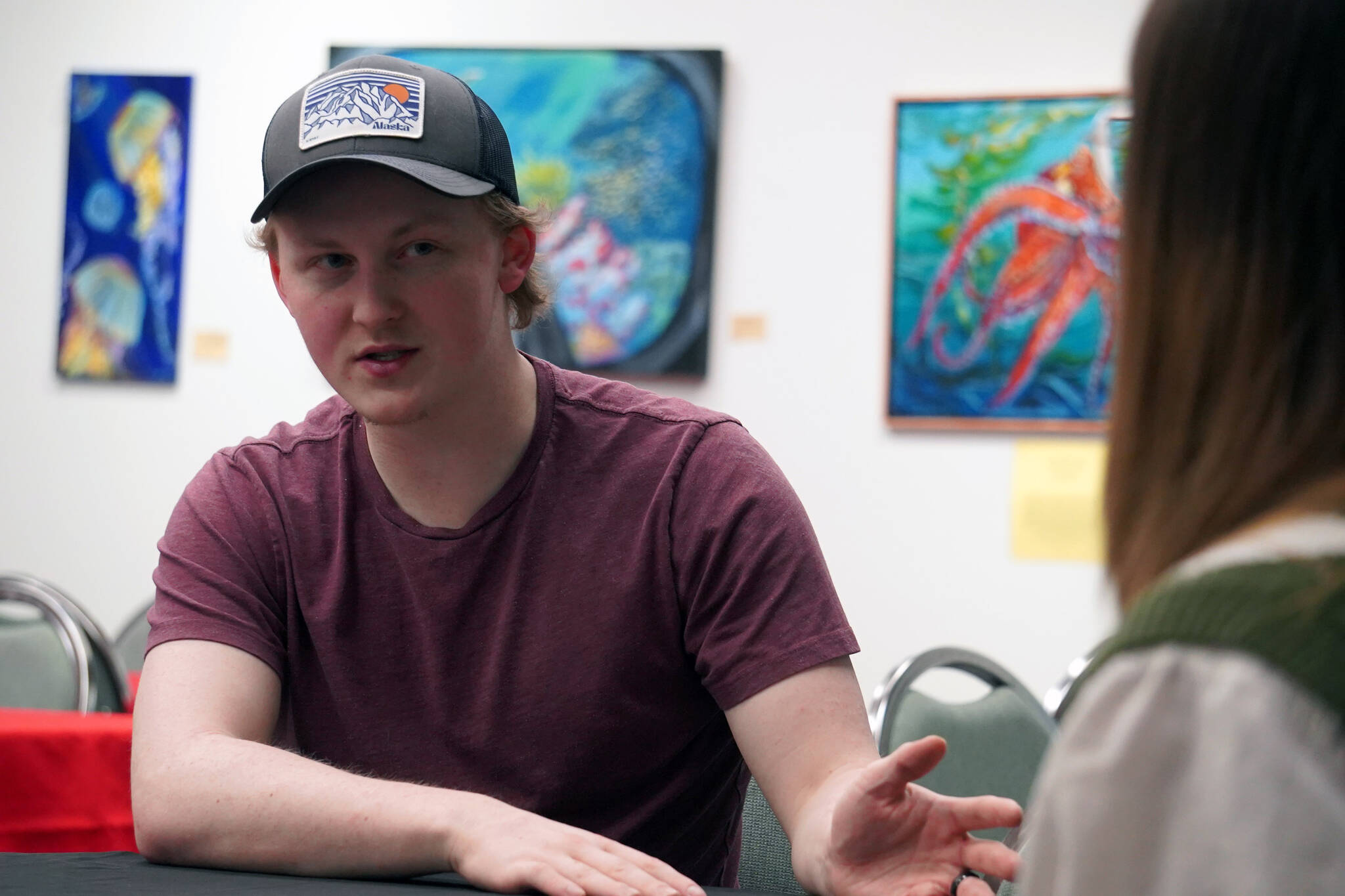 Liam Floyd is interviewed by Michelle Duffield at the Kenai Chamber of Commerce and Visitor Center in Kenai, Alaska, on Job Shadow Day, Tuesday, Feb. 13, 2024. (Aleaha Searl/Peninsula Clarion)