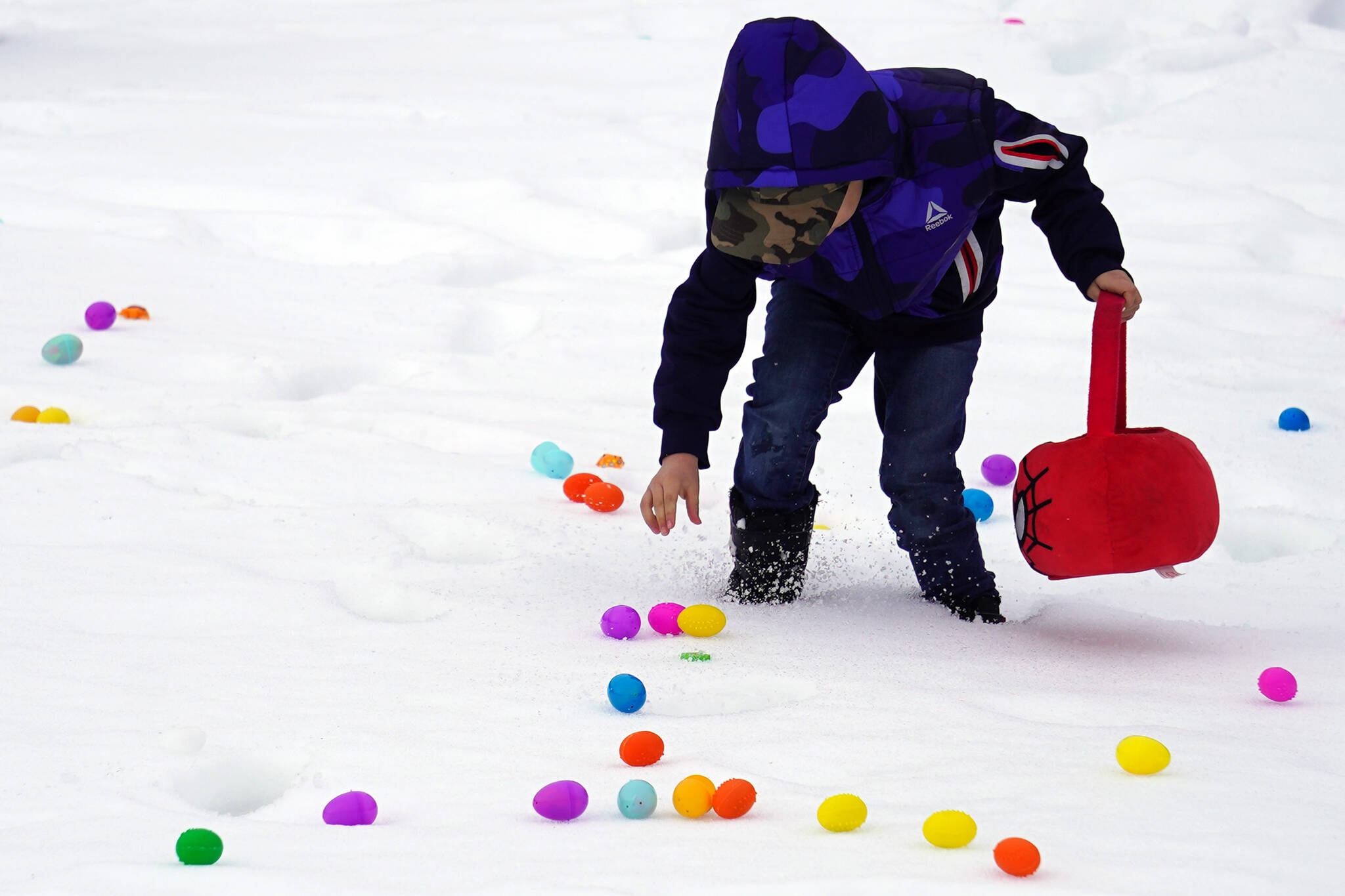 Children hunt for Easter eggs during the Easter Eggstravaganza at Nikiski Community Recreation Center in Nikiski, Alaska, on Saturday, March 23, 2024. (Jake Dye/Peninsula Clarion)