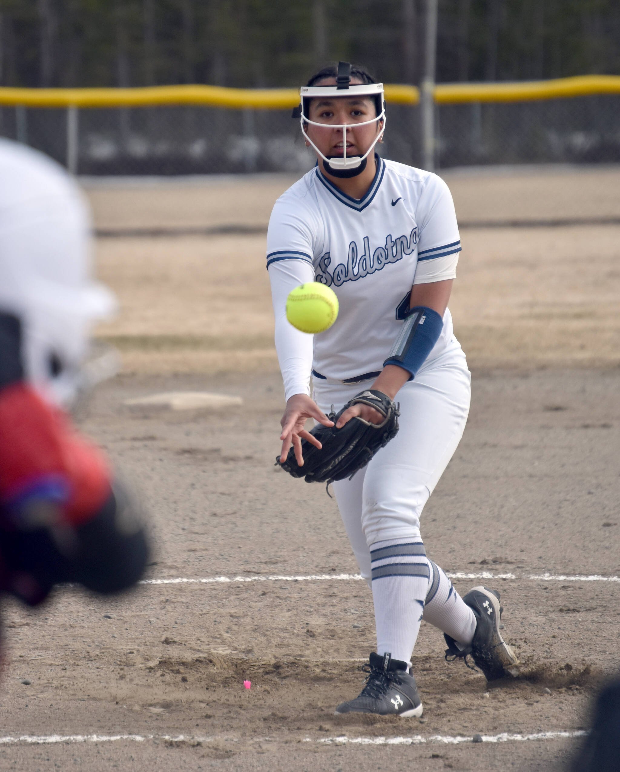 Soldotna’s Isabelle Cruz delivers to Kenai Central on Tuesday, April 30, 2024, at the Soldotna Little League fields in Soldotna, Alaska. (Photo by Jeff Helminiak/Peninsula Clarion)