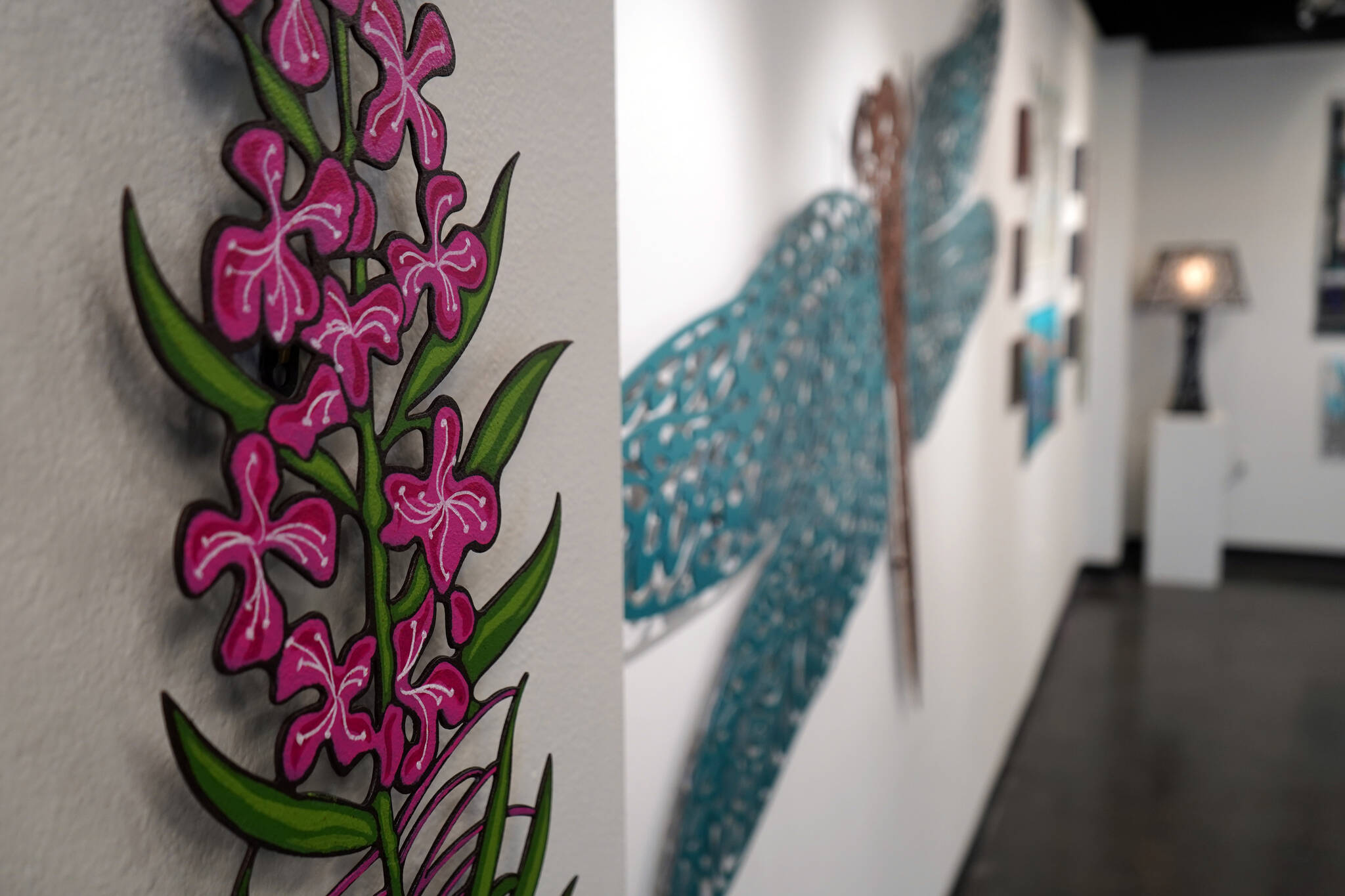 Art by Chelline Larsen and Adam Hoyt, for “Stitch, Paint, Fabricate,” fills the walls of the Kenai Art Center in Kenai, Alaska, on Wednesday, May 1, 2024. (Jake Dye/Peninsula Clarion)