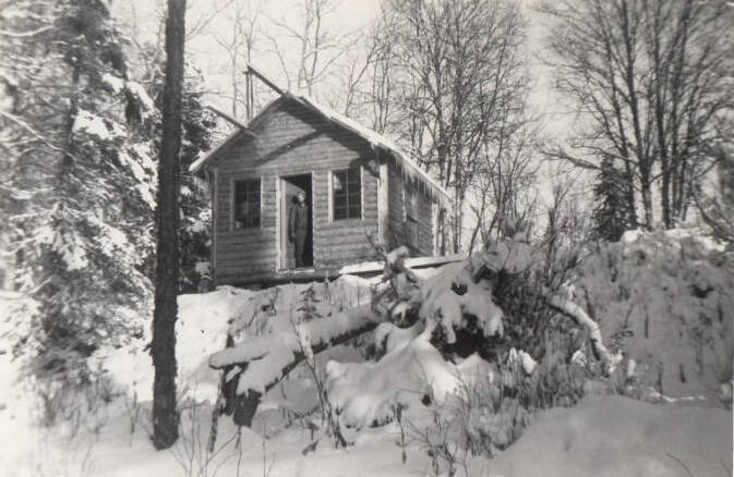 Little Family photo courtesy of the Soldotna Historical Society
Ira Little poses in the doorway of the cabin he recently completed with the help of his buddy, Marvin Smith, in the winter of 1947-48. The cabin stood on a high bank above the Kenai River in the area that would soon be known as Soldotna.
