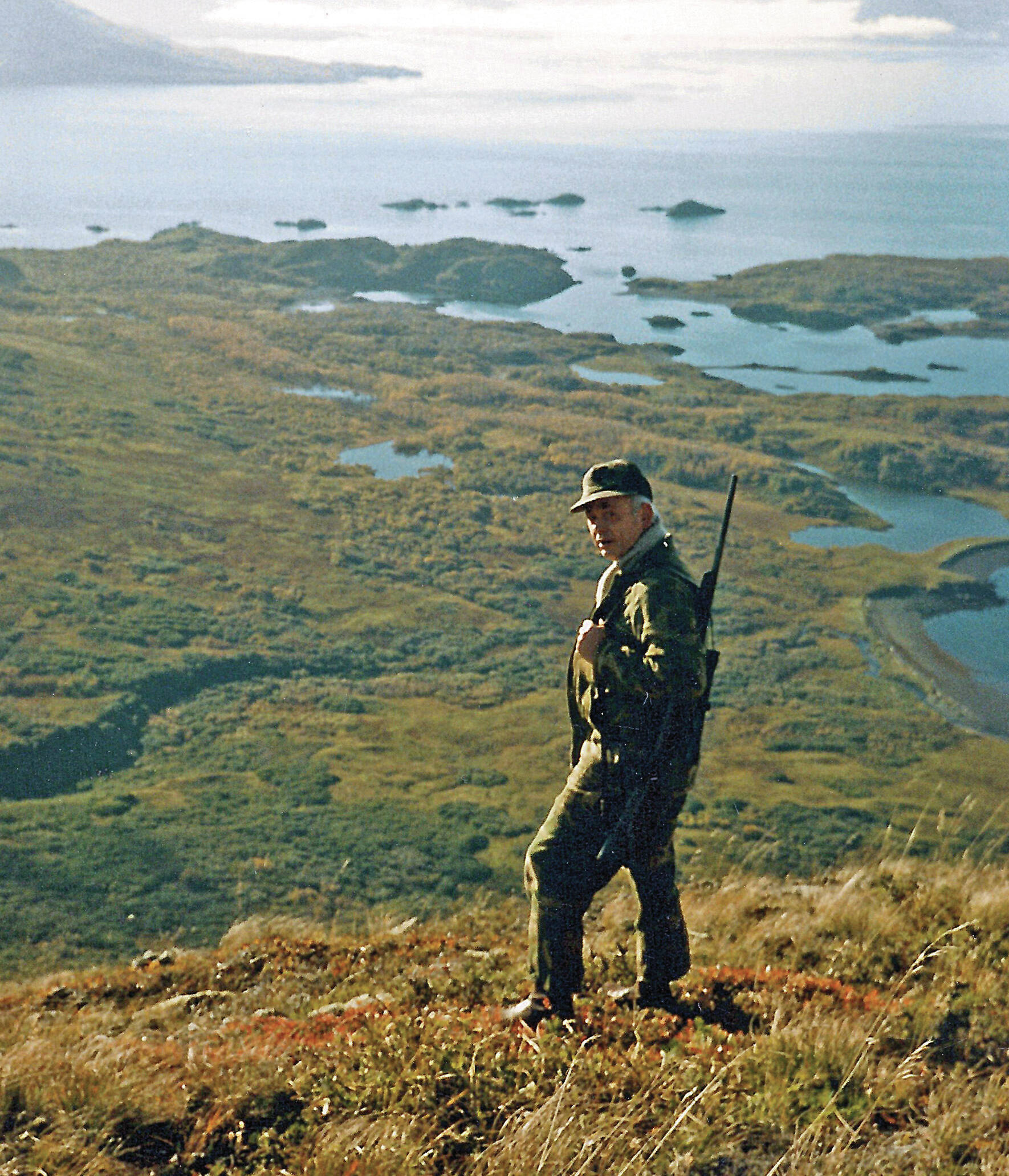 Calvin Fair, in his element, on Buck Mountain, above Chief Cove on Kodiak Island, in October 1986. His hunting partner and longtime friend Will Troyer captured this image while they were on one of the duo’s annual deer-hunting trips. (Photo courtesy of the Fair Family Collection)