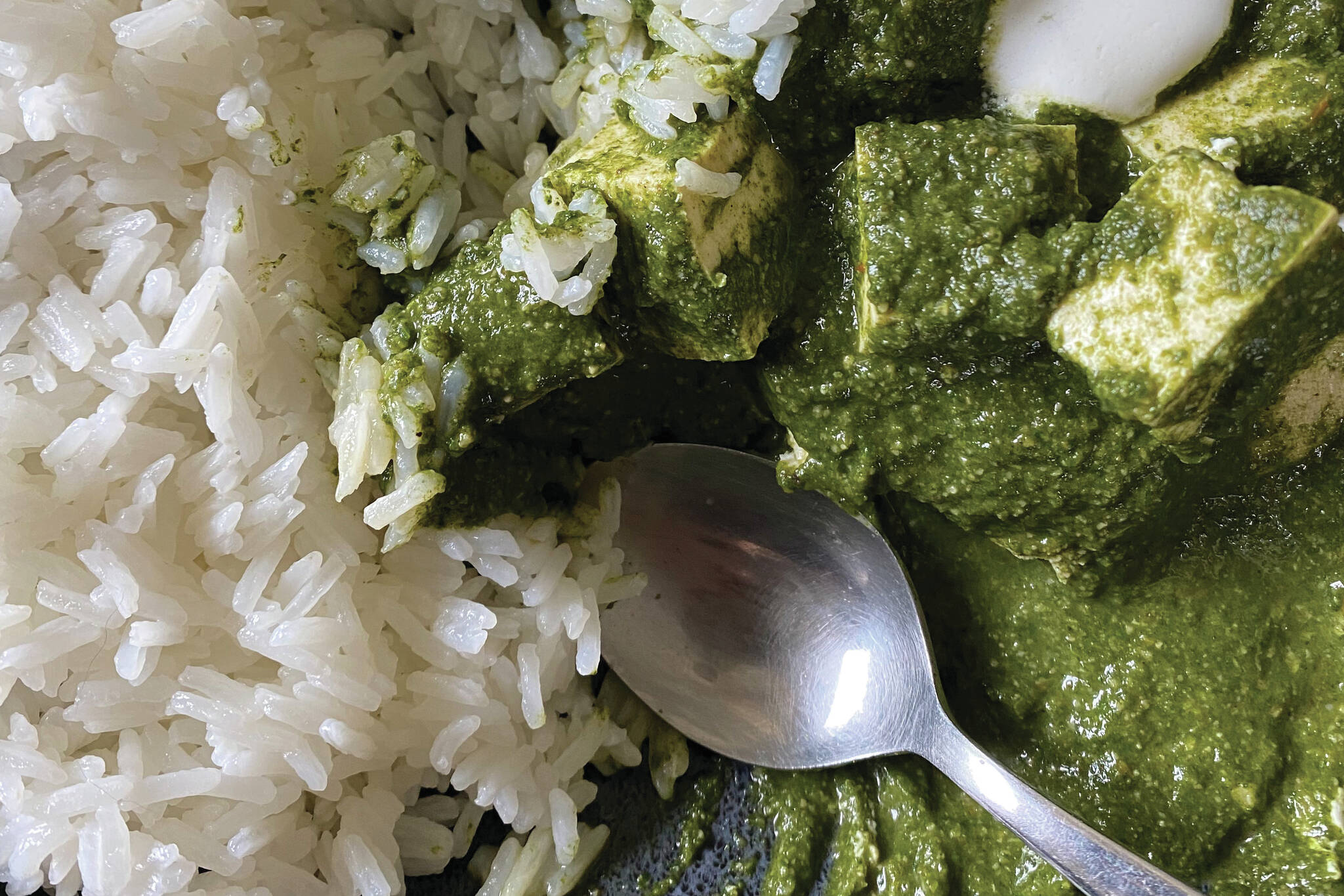 Palak tofu, served here with rice, is a vegan version of palak paneer. (Photo by Tressa Dale/Peninsula Clarion)