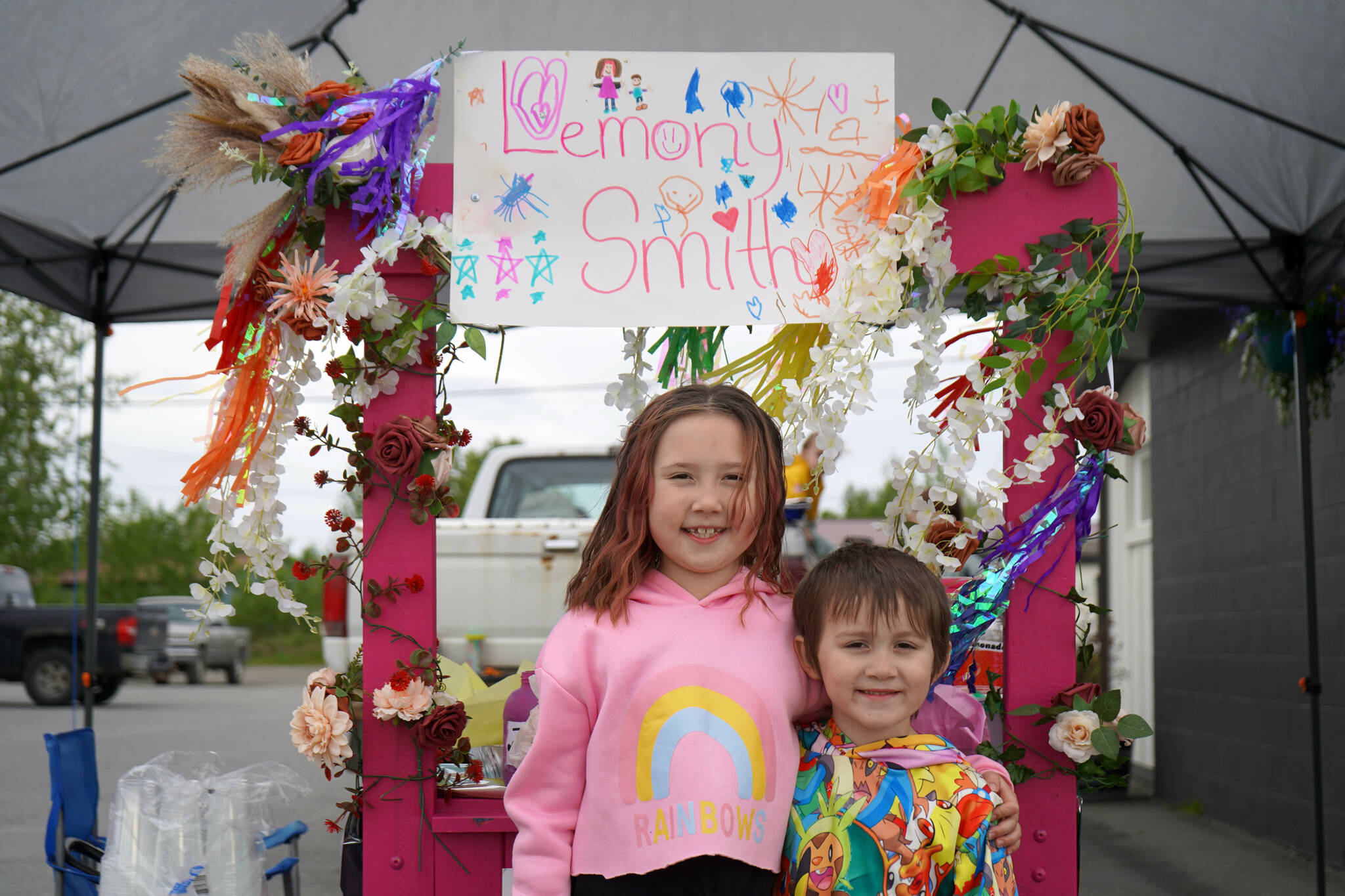 Rylee Smith operates her lemonade stand, Lemony Smith’s, outside of Orange Poppy in Soldotna, Alaska, during Lemonade Day on Saturday, June 8, 2024. (Jake Dye/Peninsula Clarion)