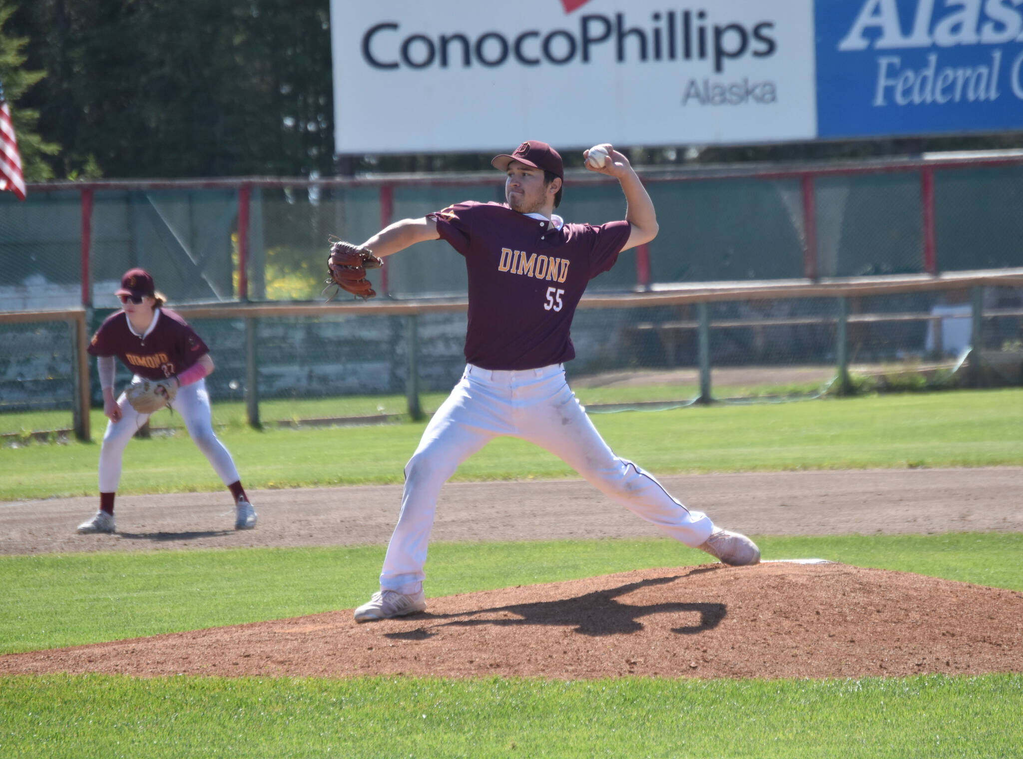 Colin Doherty of Dimond Lynx Post 21 delivers to the American Legion Post 20 Twins on Saturday, June 15, 2024, at Coral Seymour Memorial Park in Kenai, Alaska. (Photo by Jeff Helminiak/Peninsula Clarion)