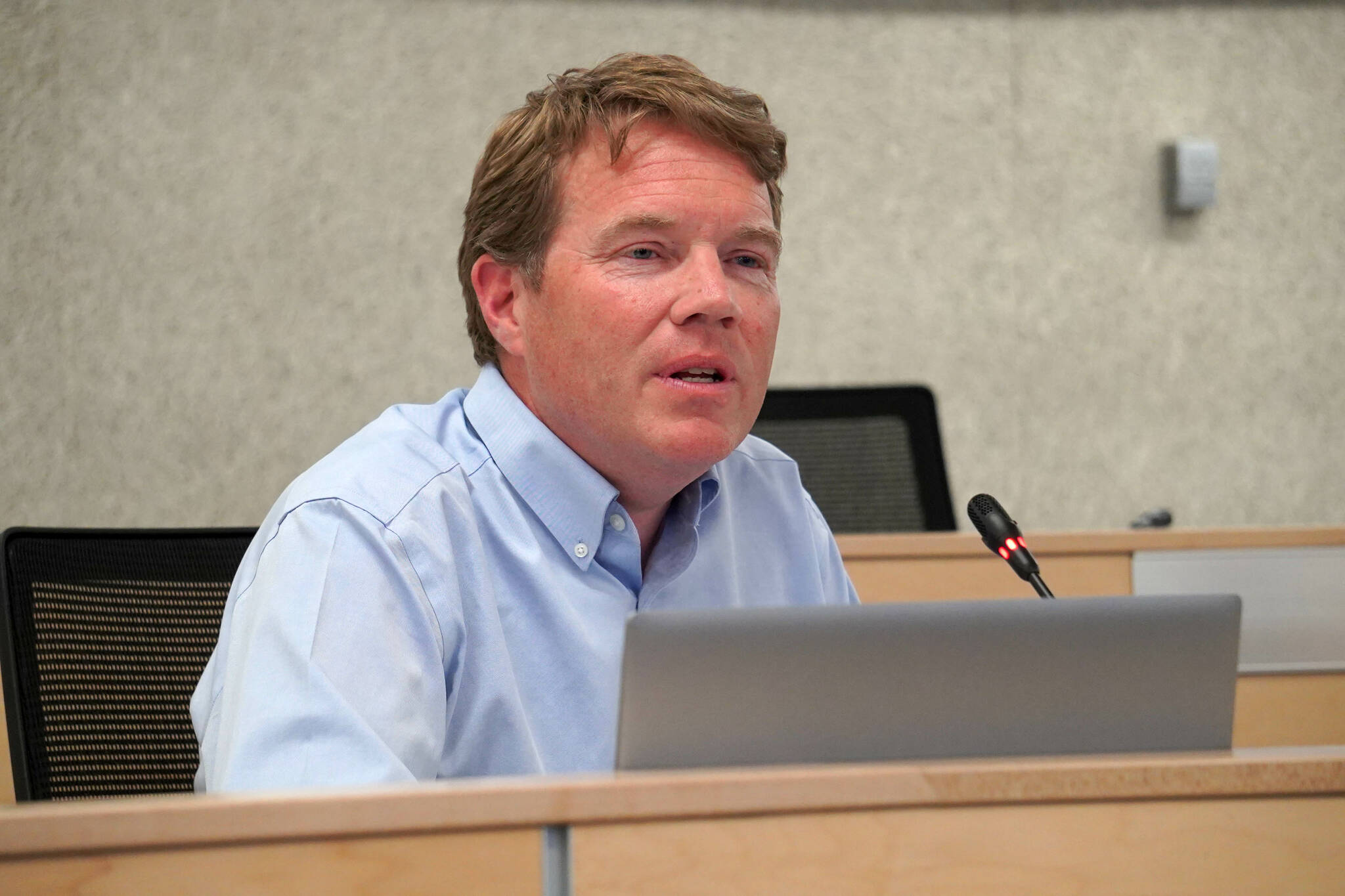 Alaska Department of Transportation Commissioner Ryan Anderson speaks during a town hall meeting on the use of brine on Kenai Peninsula roads, in the Kenai Peninsula Borough Assembly Chambers in Soldotna, Alaska, on Monday, June 17, 2024. (Jake Dye/Peninsula Clarion)