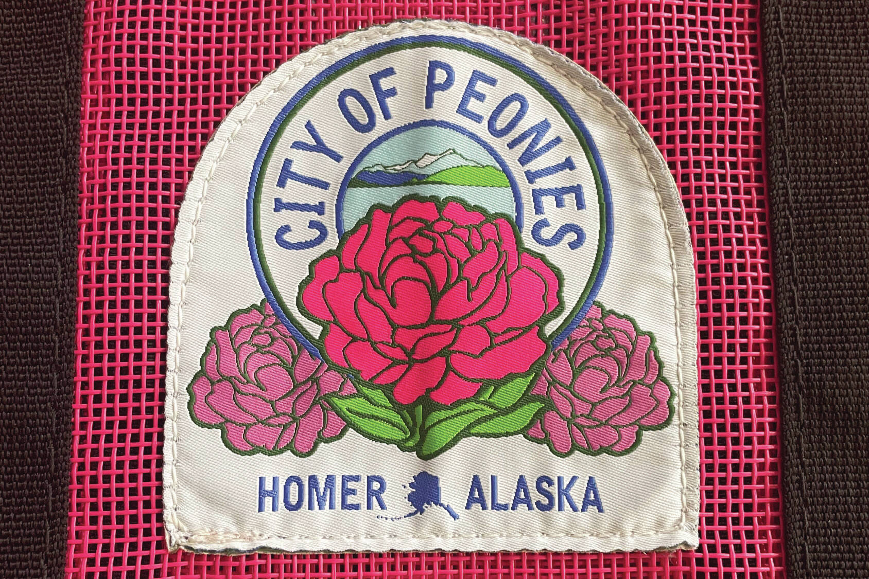 Photo by Emilie Springer/Homer News
Homer’s official peony patch is attached to a Nomar tote bag, available for purchase at the Homer Chamber of Commerce, during the month of July.