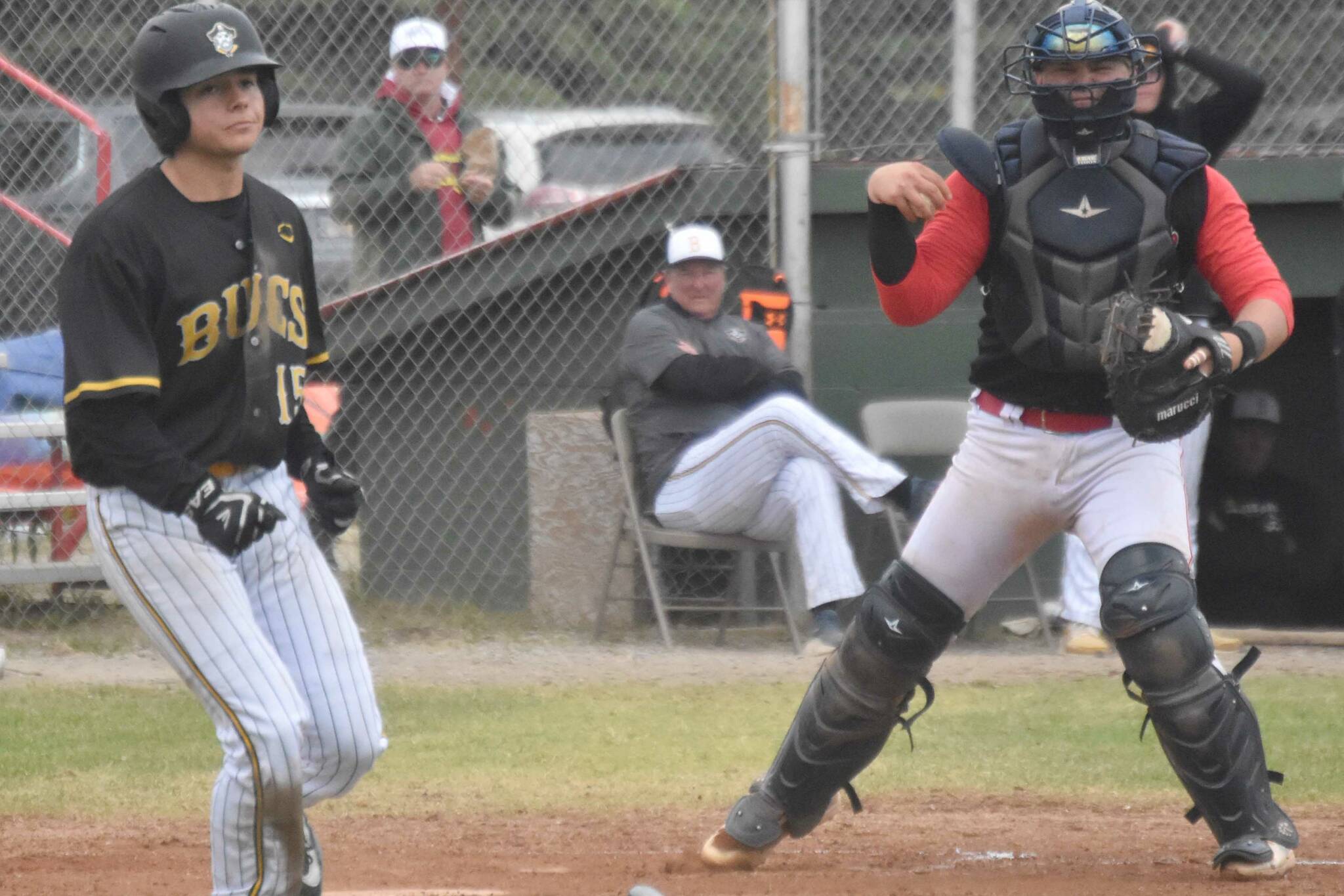 Peninsula Oilers catcher Brock Wirthgen celebrates after tagging out Christian Powell of the Anchorage Bucs for the final out of the game Saturday, June 29, 2024, at Coral Seymour Memorial Park in Kenai, Alaska. (Photo by Jeff Helminiak/Peninsula Clarion)