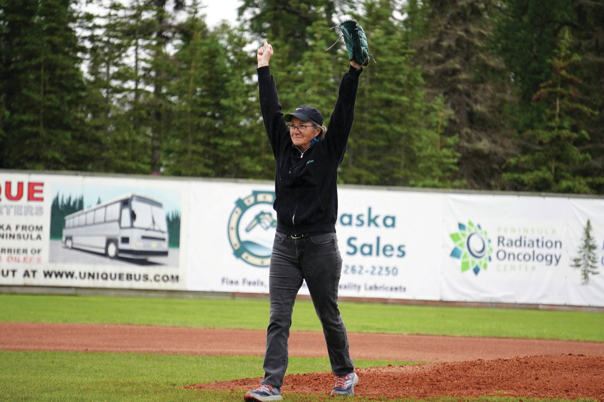 Jake Dye/Peninsula Clarion
Lisa Parker, vice mayor of Soldotna, celebrates after throwing the ceremonial first pitch before a game between the Peninsula Oilers and the Mat-Su Miners on Tuesday, July 4, 2023, at Coral Seymour Memorial Park in Kenai.