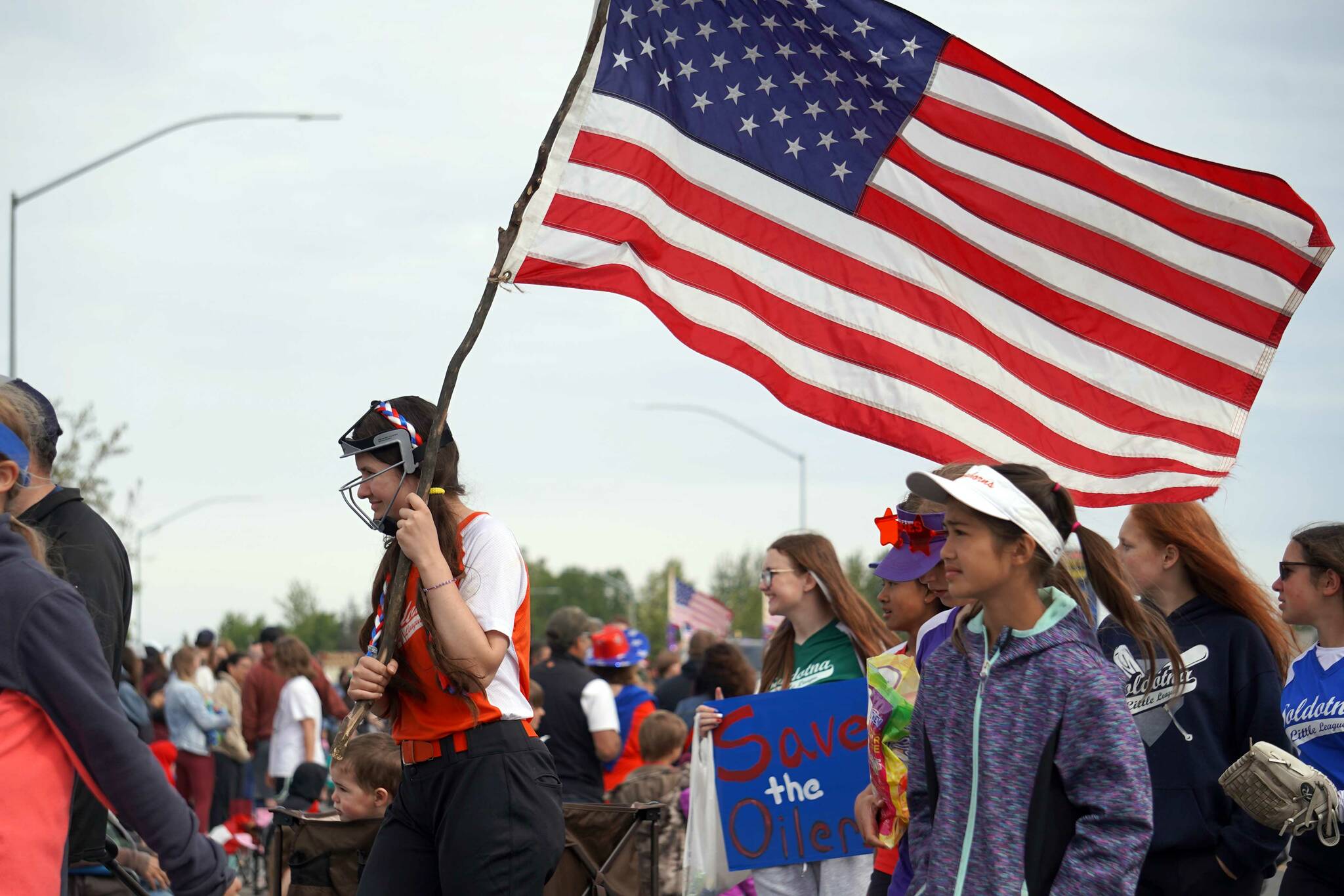 The Soldotna Little League proceeds down the Kenai Spur Highway in Kenai, Alaska, during the Fourth of July Parade on Thursday, July 4, 2024. (Jake Dye/Peninsula Clarion)