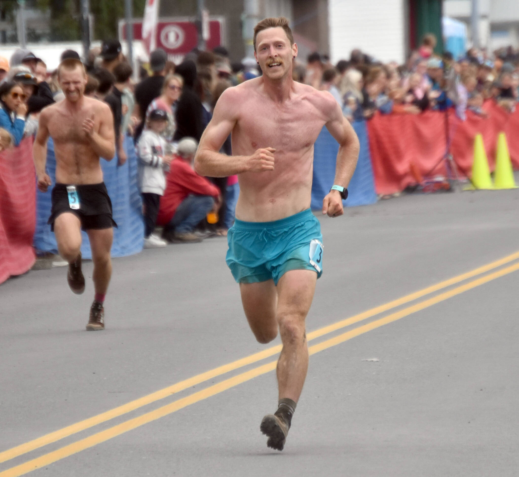 Anchorage’s Lars Arneson, a 2009 graduate of Cook Inlet Academy, finishes ninth in the men’s race at the Mount Marathon Race on Thursday, July 4, 2024, in Seward, Alaska. (Photo by Jeff Helminiak/Peninsula Clarion)