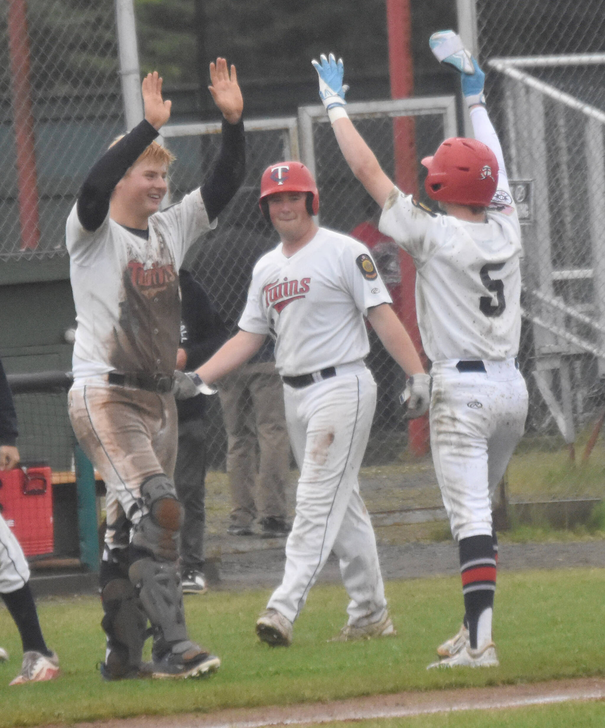 Post 20 Twins catcher Jayden Stuyvesant congratulates Malakai Olson on the game-winning hit Saturday, July 6, 2024, at Coral Seymour Memorial Park in Kenai, Alaska. (Photo by Jeff Helminiak/Peninsula Clarion)