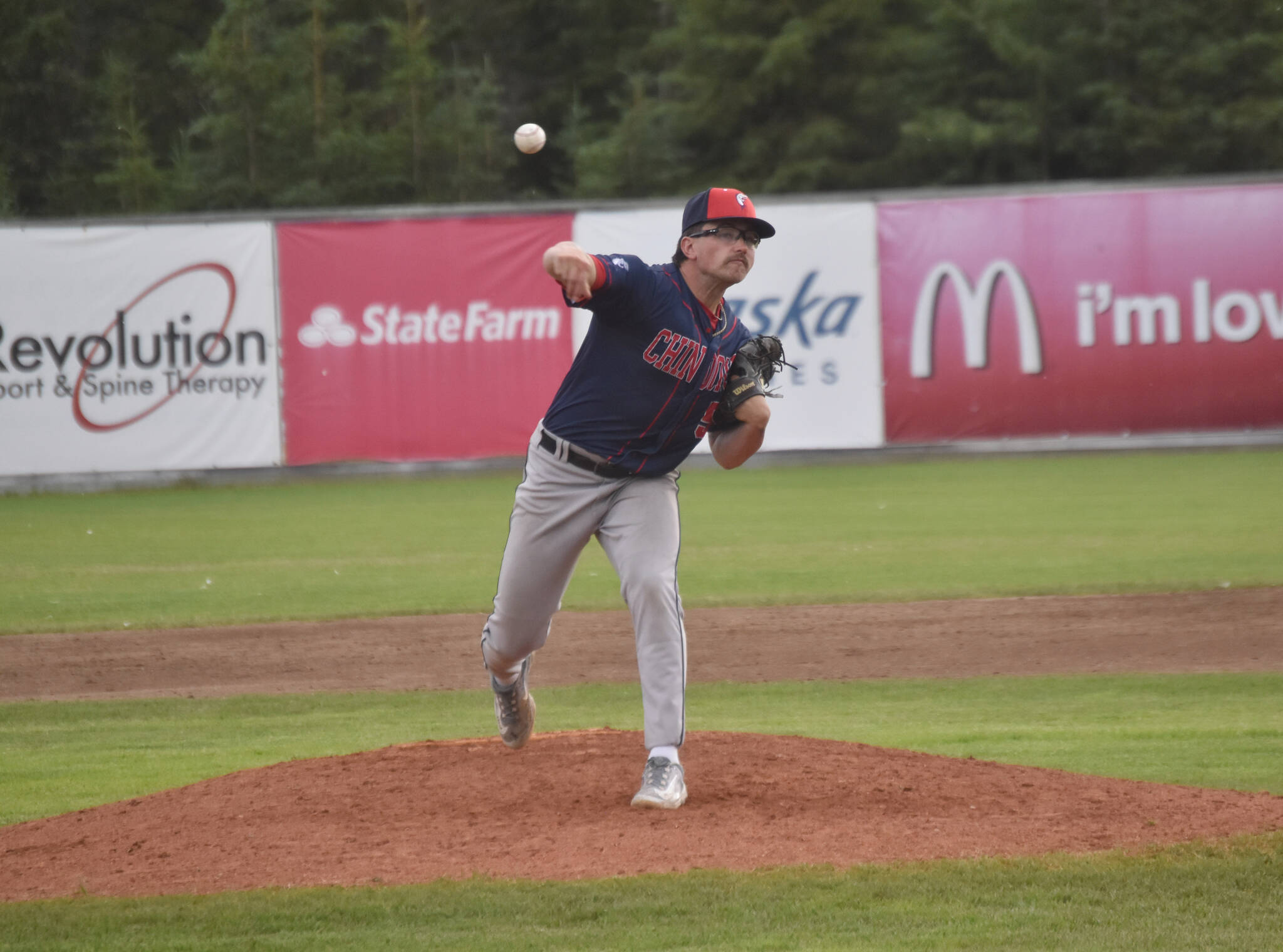 Chugiak-Eagle River Chinooks starter Frankie Gulko delivers to the Peninsula Oilers on Thursday, July 11, 2024, at Coral Seymour Memorial Park in Kenai, Alaska. (Photo by Jeff Helminiak/Peninsula Clarion)