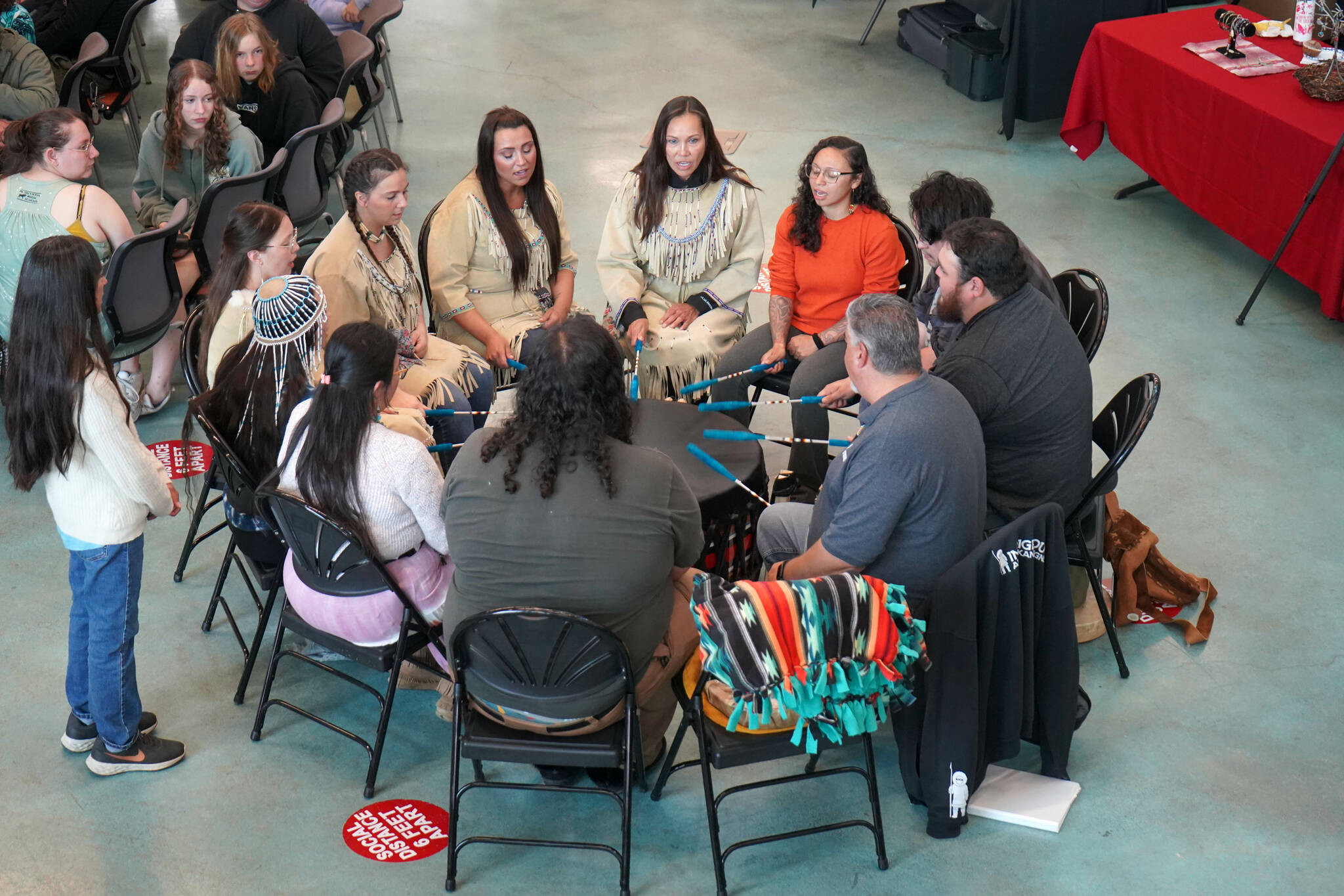 Drummers perform during a celebration of the 10th anniversary of the Dena’ina Wellness Center in Kenai, Alaska, on Friday, July 12, 2024. (Jake Dye/Peninsula Clarion)