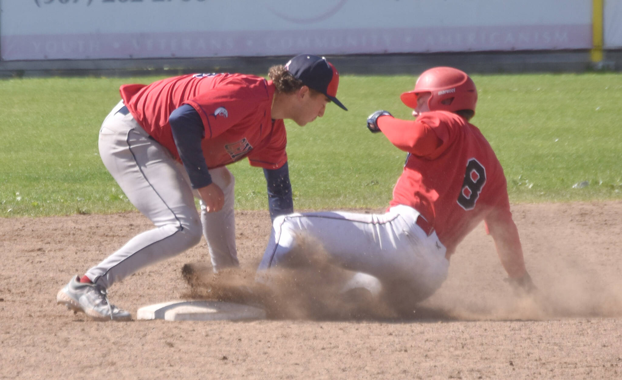 Chugiak-Eagle River Chinooks second baseman Louis Zulaica tags out Bryce Burkey of the Peninsula Oilers on a steal attempt during the first game of a doubleheader Sunday, July 14, 2024, at Coral Seymour Memorial Park in Kenai, Alaska. (Photo by Jeff Helminiak/Peninsula Clarion)