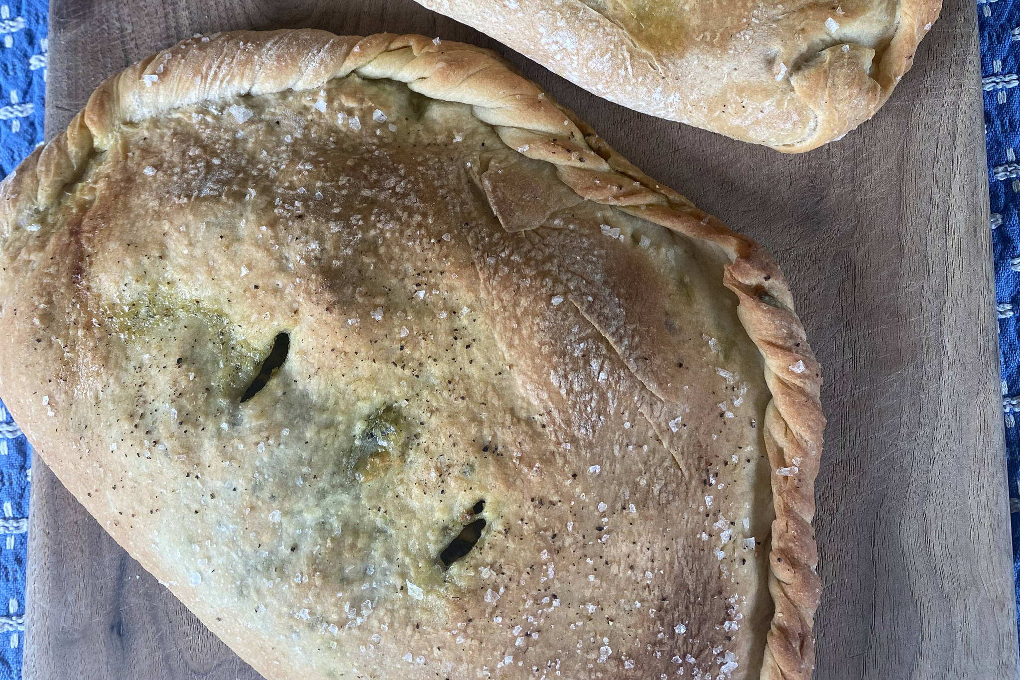 Calzones stuffed with arugula pesto and cheese make for a fun summer meal. (Photo by Tressa Dale/Peninsula Clarion)