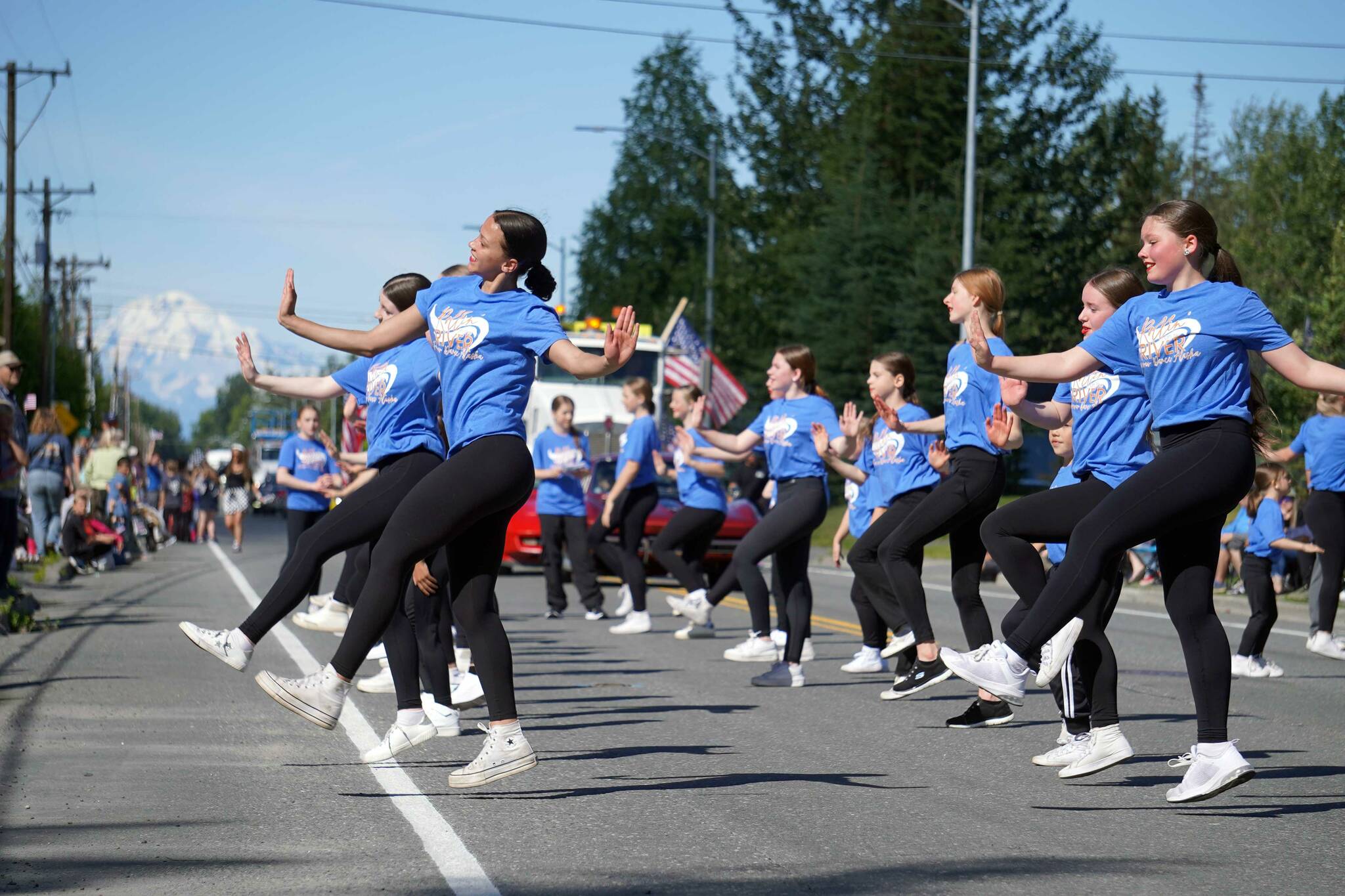 Forever Dance Alaska performers deliver a routine while walking with the 67th Annual Soldotna Progress Days Parade on Marydale Avenue in Soldotna, Alaska, on Saturday, July 27, 2024. (Jake Dye/Peninsula Clarion)