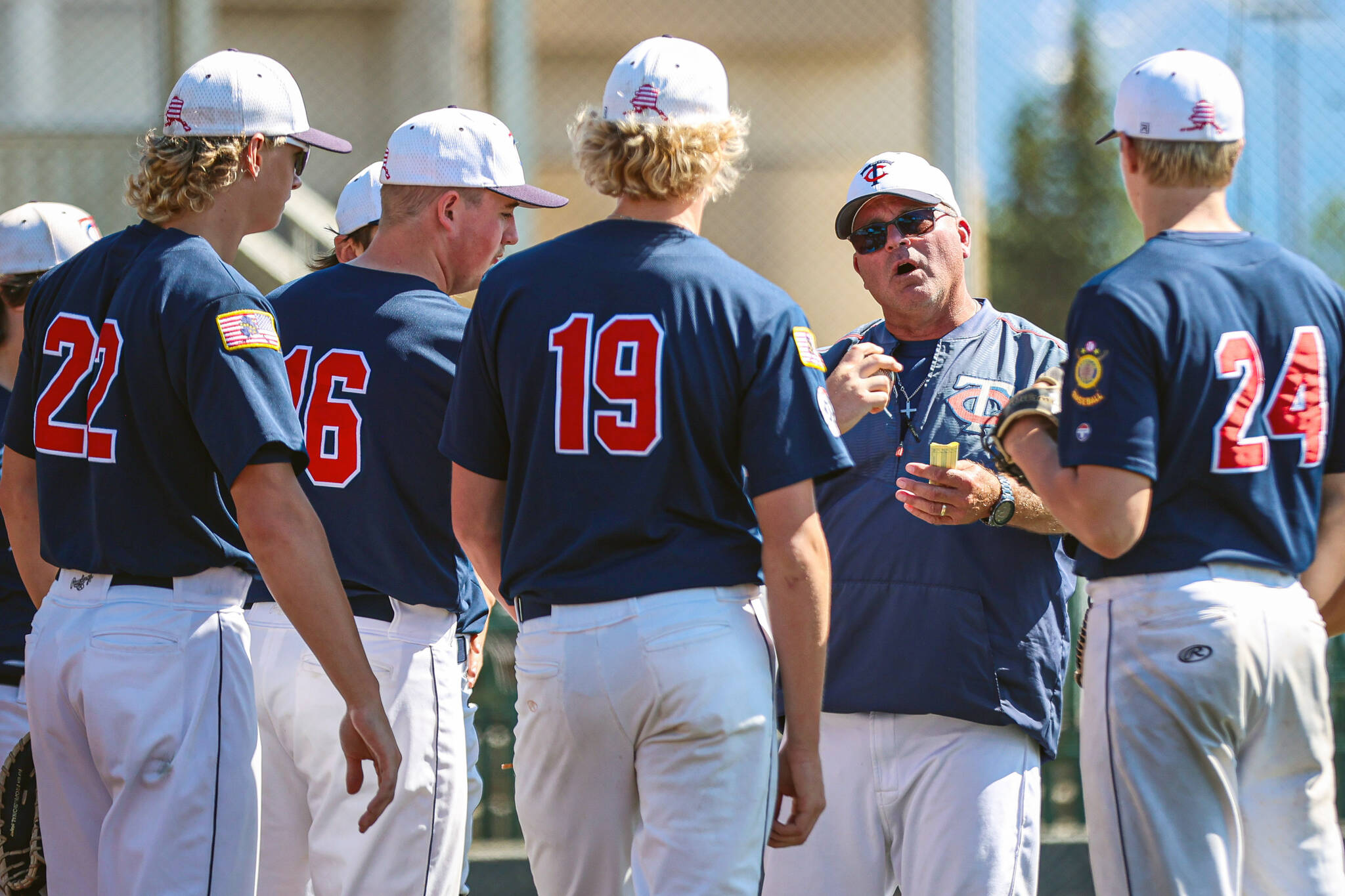 Twins head coach Robb Quelland talks to his team at the 72nd Alaska Legion Baseball State Tournament over the weekend at Mulcahy Stadium in Anchorage, Alaska. (Photo by Stephanie Burgoon/Alaska Sports Report)