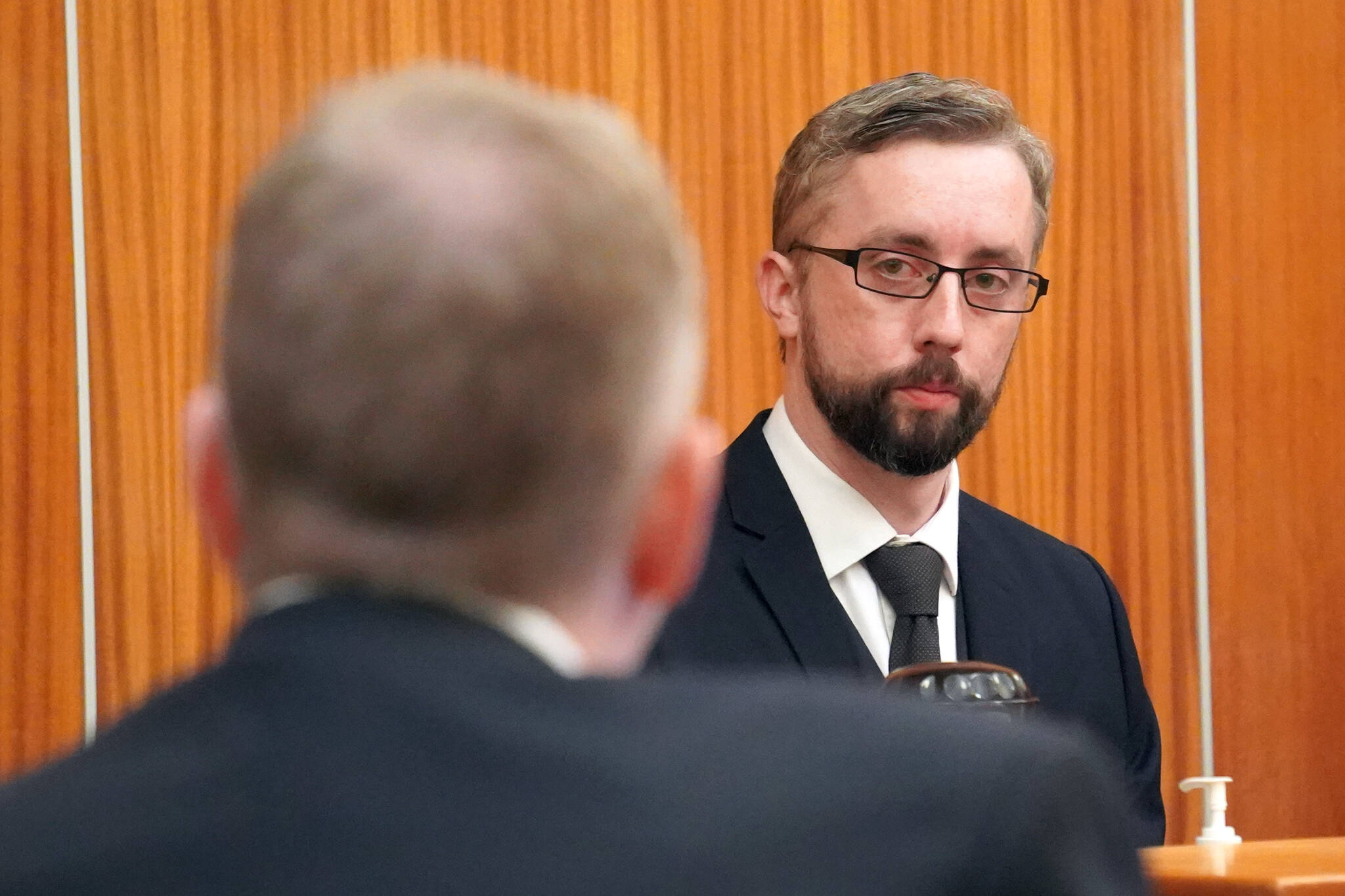 Nathan Erfurth, right, responds to questions from his attorney Eric Derleth during an evidentiary hearing at the Kenai Courthouse in Kenai, Alaska, on April 12, 2024. (Jake Dye/Peninsula Clarion)