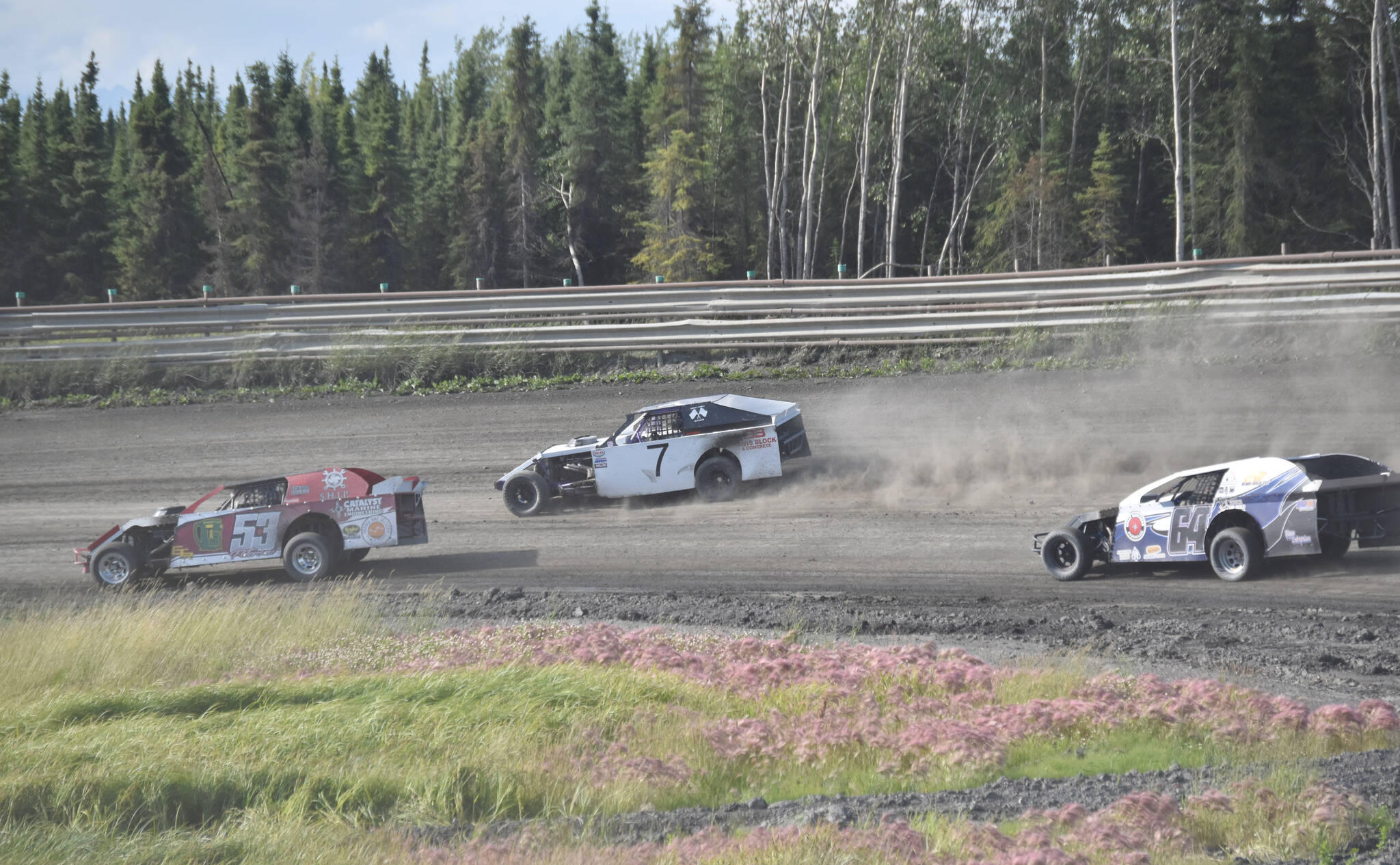 Clay Petersen leads Jesse Yancy and Dustin Bass in Heat 1 of Modifieds on Saturday, July 27, 2024, at Twin City Raceway in Kenai, Alaska. Bass would win the race, while Yancy was second and Petersen was third. (Photo by Jeff Helminiak/Peninsula Clarion)