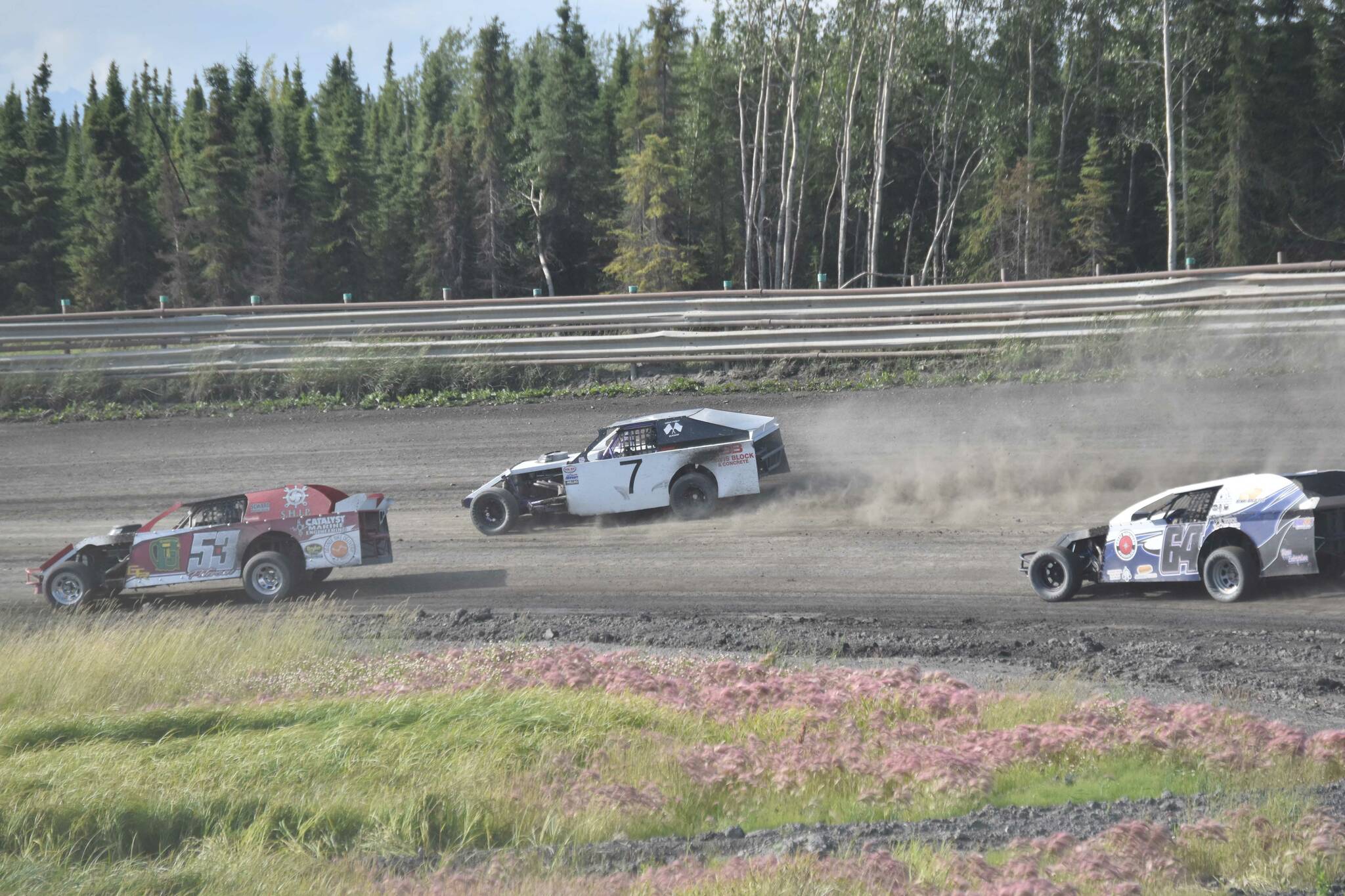 Clay Petersen leads Jesse Yancy and Dustin Bass in Heat 1 of Modifieds on Saturday, July 27, 2024, at Twin City Raceway in Kenai, Alaska. Bass would win the race, while Yancy was second and Petersen was third. (Photo by Jeff Helminiak/Peninsula Clarion)