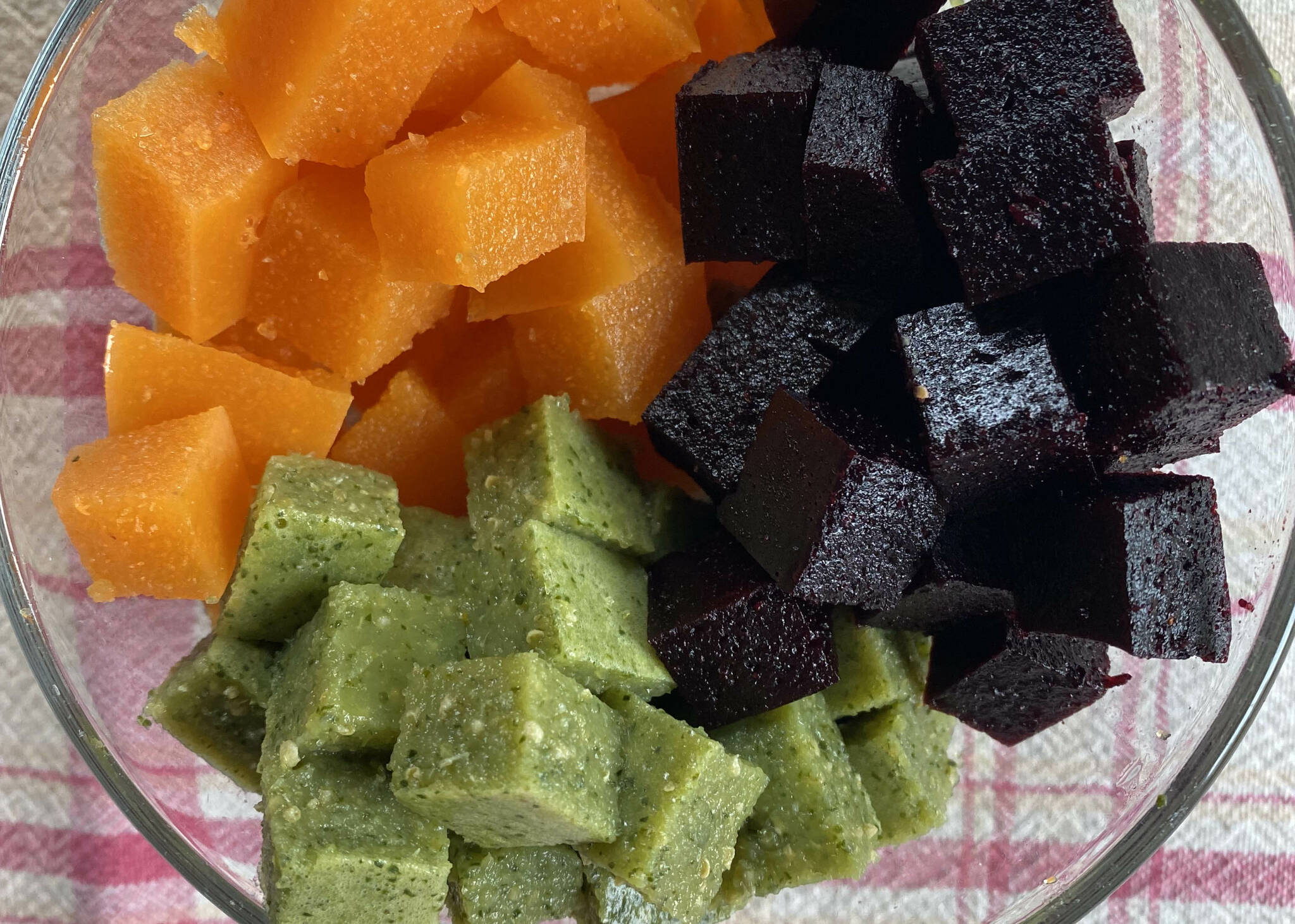 These blueberry and honey, carrot and nectarine, and spinach and green grape gummies are made with minimal sugar and no artificial dyes or preservatives. (Photo by Tressa Dale/Peninsula Clarion)