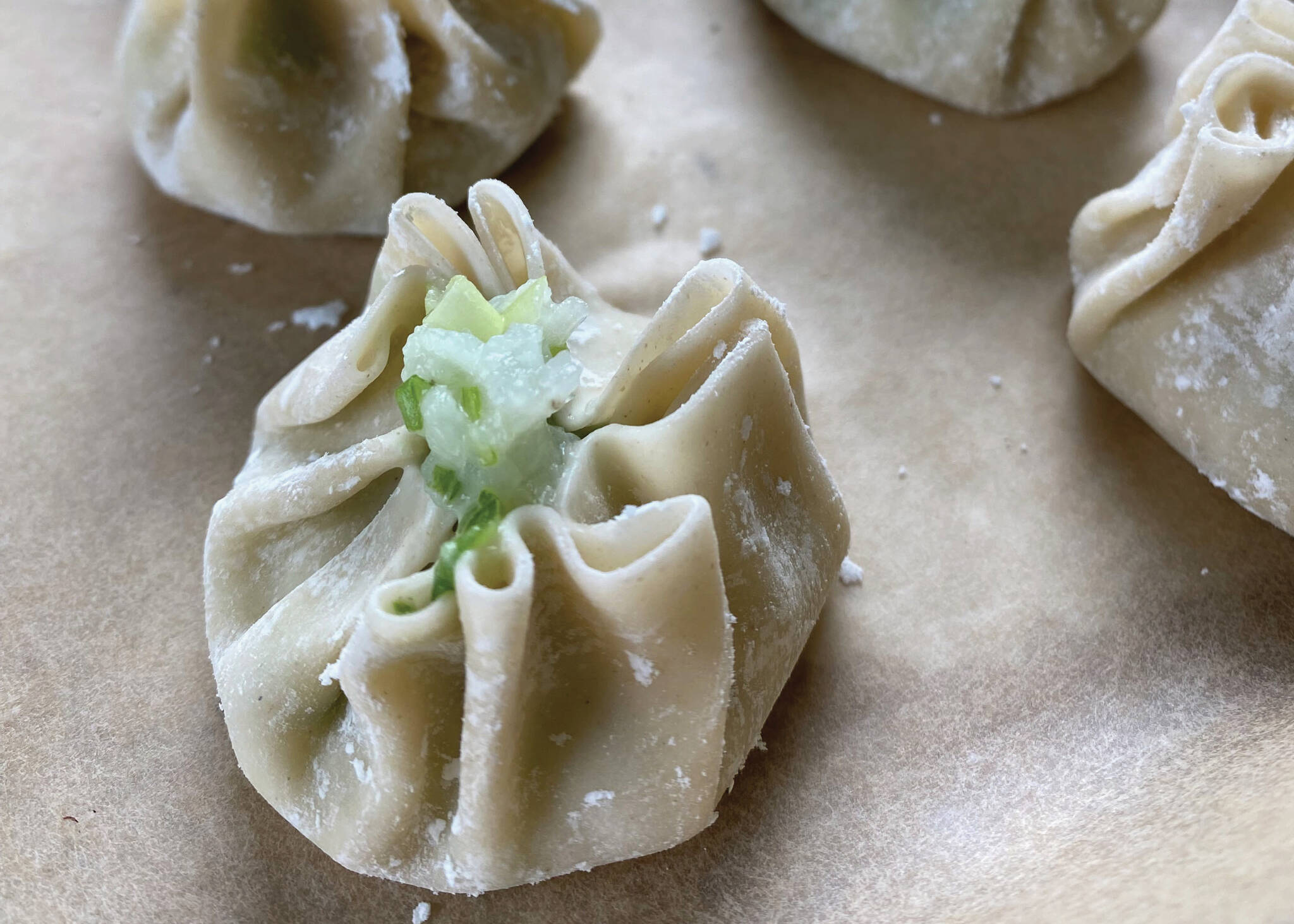 Gyoza wrappers are filled with shrimp and onion paste. (Photo by Tressa Dale/Peninsula Clarion)