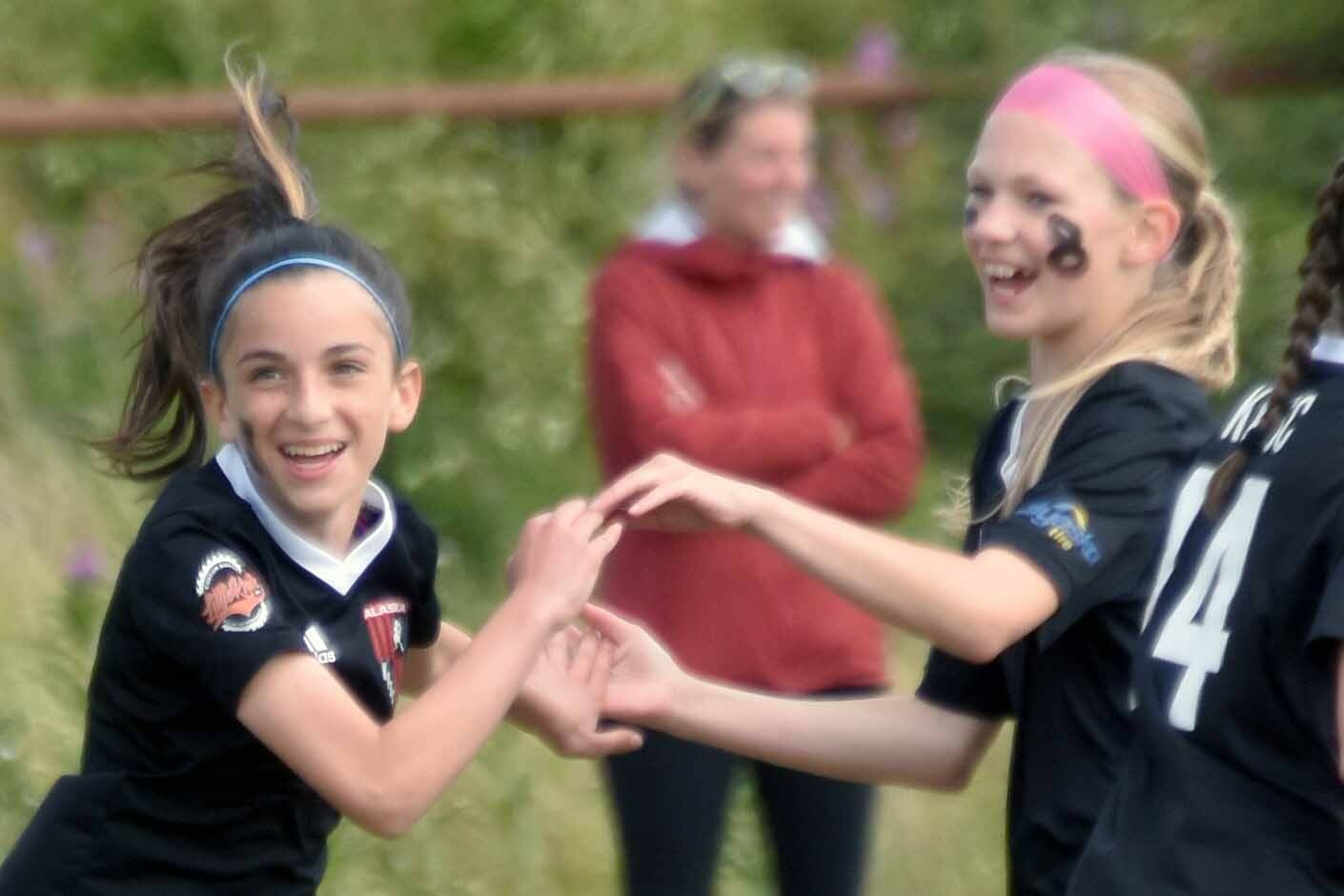 Kenai Kicks' Avi Bloom, second from left, celebrates her goal with, from left to right, Lily Hough, Morgan Buckbee and Morgan Berger on Saturday, Aug. 3, 2024, at the Kenai Sports Complex in Kenai, Alaska, in a U13 Alaska Youth State Cup game against Cook Inlet Soccer Club. (Photo by Jeff Helminiak/Peninsula Clarion)