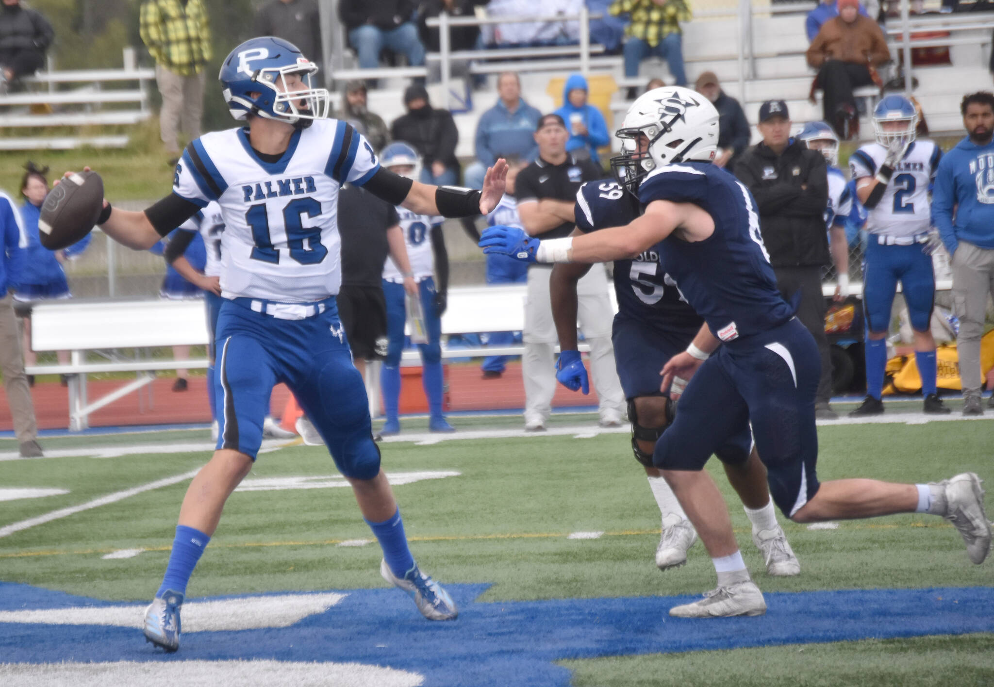 Palmer quarterback Nolan Garner passes under pressure from Soldotna linebacker Trevor Michael on Friday, Aug. 16, 2024, at Justin Maile Field at Soldotna High School in Soldotna, Alaska. (Photo by Jeff Helminiak/Peninsula Clarion)