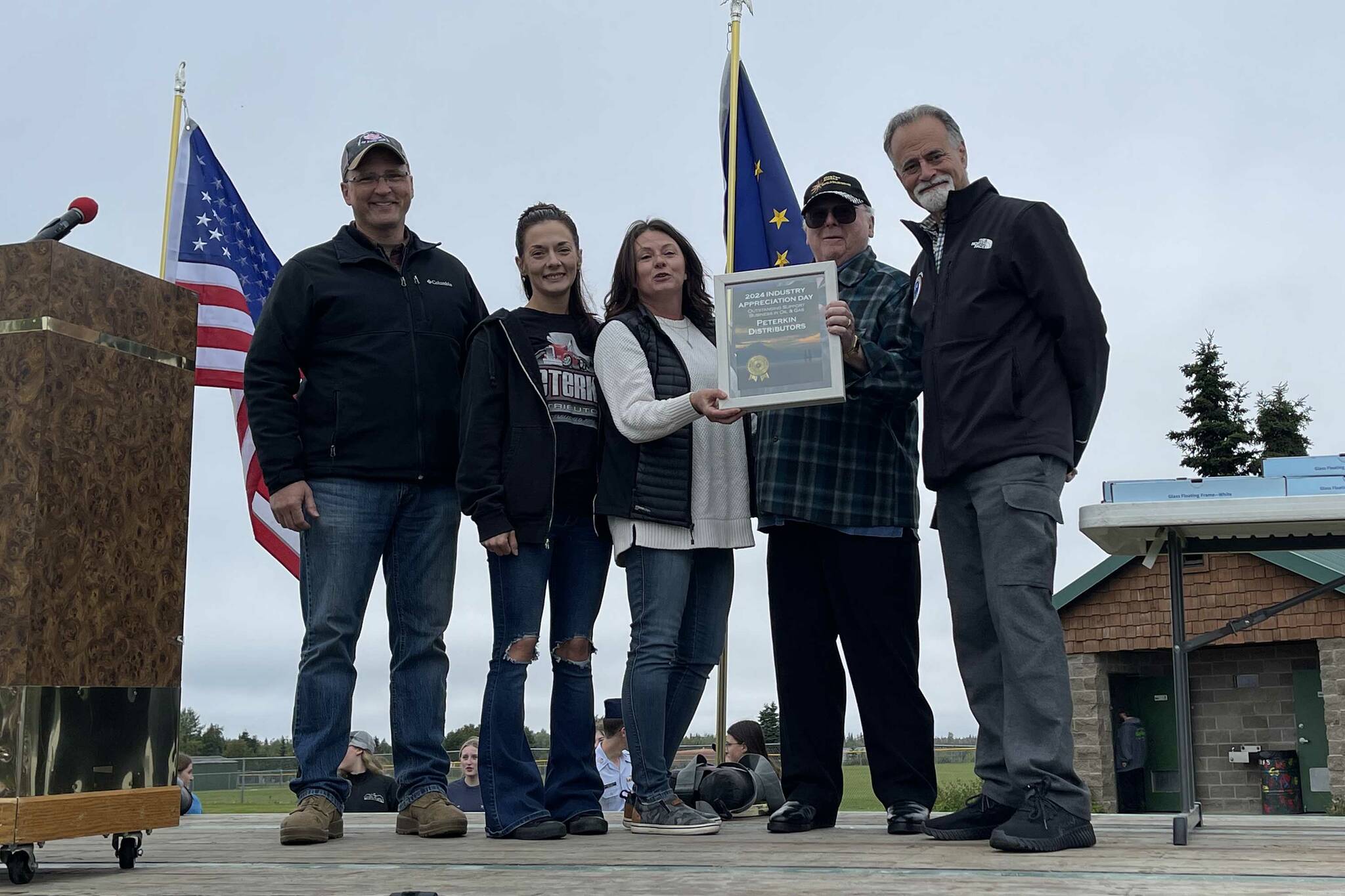 Peterkin Distributors receives the Outstanding Support Business in Oil & Gas award at Industry Appreciation Day in Kenai, Alaska, on Saturday, Aug. 17, 2024. (Jake Dye/Peninsula Clarion)