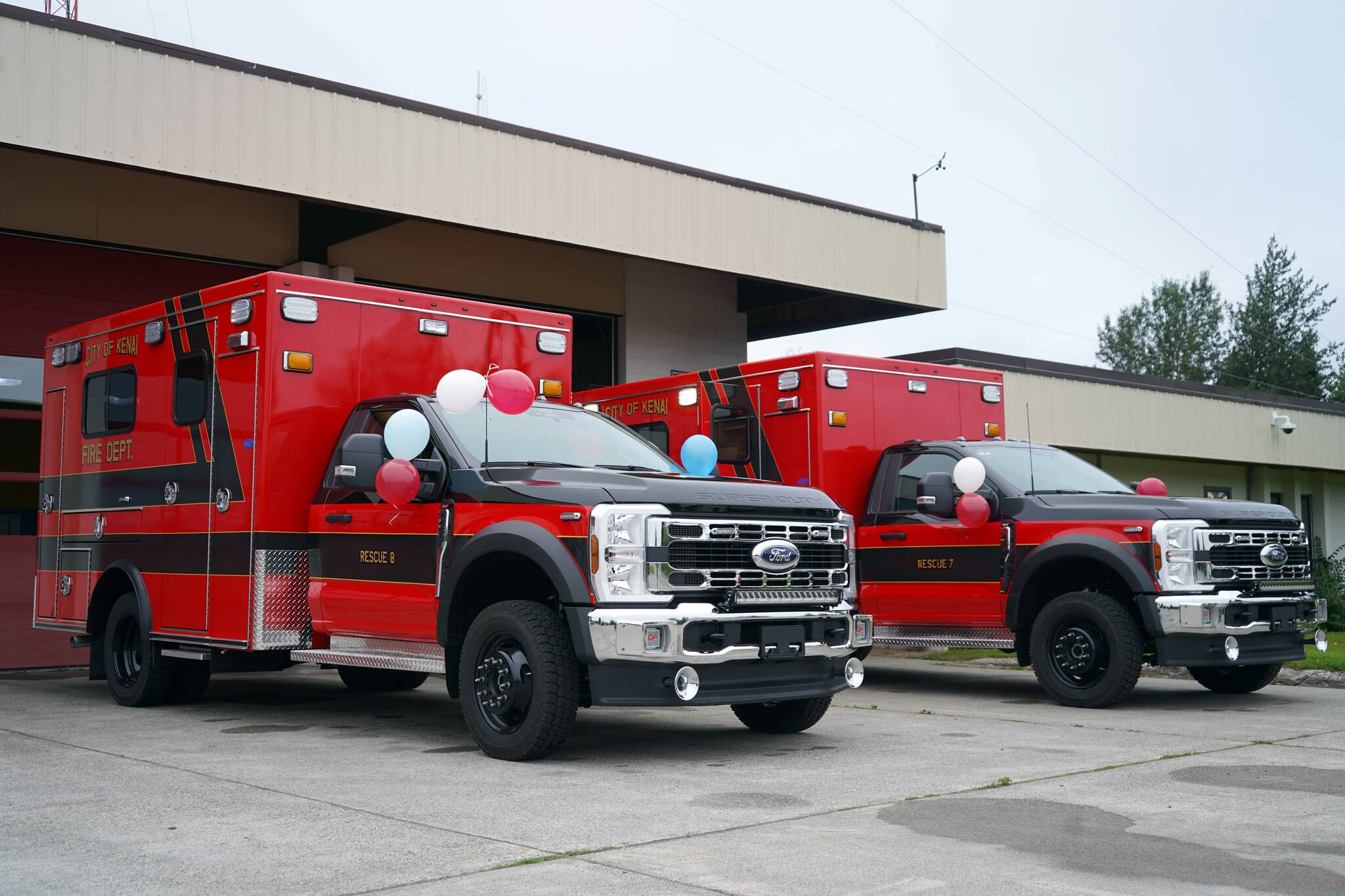 A pair of new ambulances are seen ahead of their dedication ceremony at the Kenai Public Safety Building in Kenai, Alaska, on Saturday, Aug. 17, 2024. (Jake Dye/Peninsula Clarion)