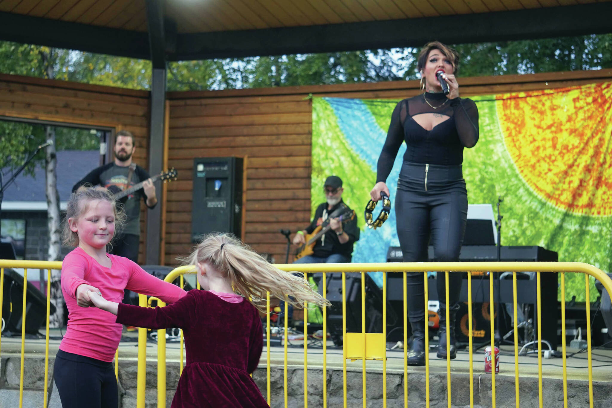 Children dance as Ellie and the Echoes perform the last night of the Levitt AMP Soldotna Music Series at Soldotna Creek Park on Wednesday. (Jake Dye/Peninsula Clarion)