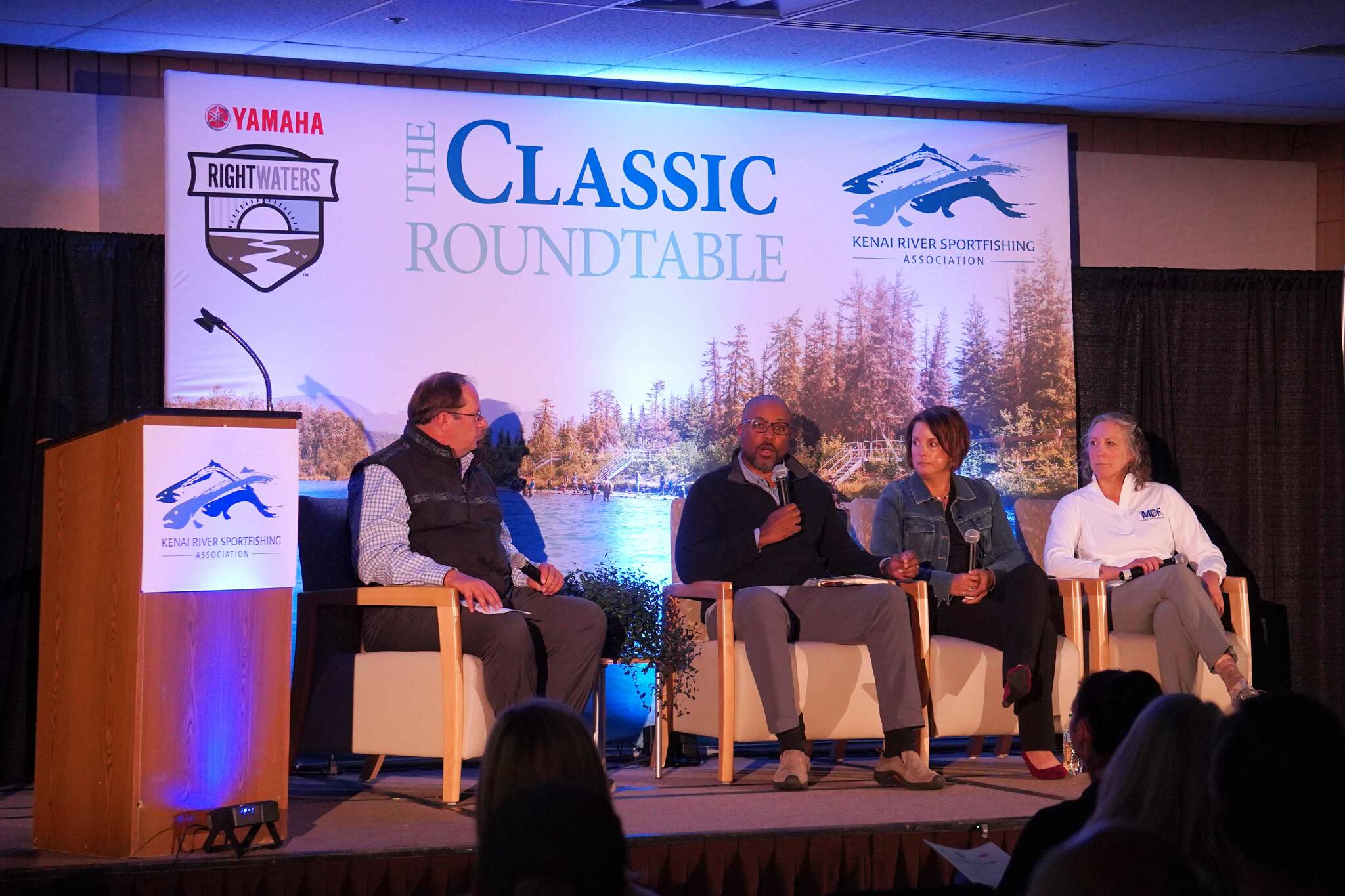 Joel Johnson, president of the National Marine Sanctuary Foundation, Carrie Hourman, lead sustainability director for Dow Climate & Circularity, and Susan Sherman, executive director of the Marine Debris Foundation sit for a panel at the Kenai River Sportfishing Association’s Kenai Classic Roundtable at the Soldotna Regional Sports Complex in Soldotna, Alaska, on Wednesday, Aug. 21, 2024. (Jake Dye/Peninsula Clarion)