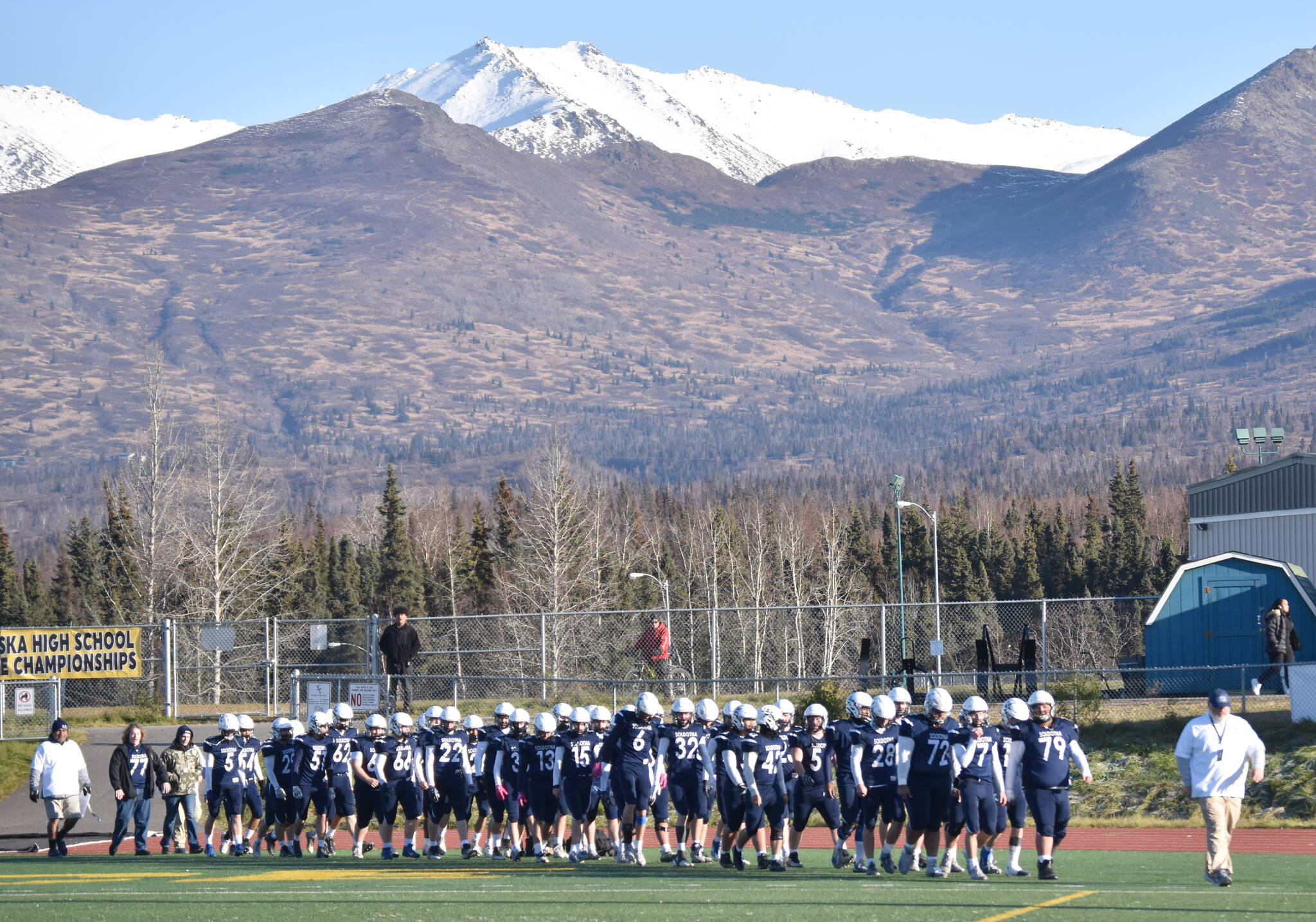 Photo by Jeff Helminiak/Peninsula Clarion
Soldotna head coach Galen Brantley Jr. leads his team back on the field after halftime Saturday, Oct. 21, 2023, in the Division II championship game at Service High School in Anchorage, Alaska.